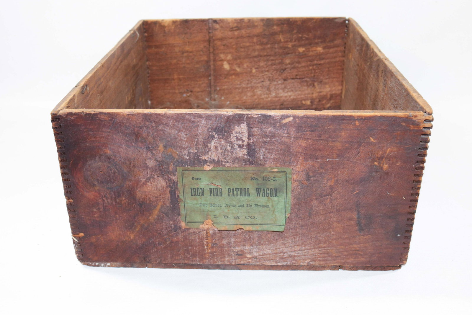 ORIGINAL IVES FIRE PATROL WAGON BOX: WOODEN BOX ONLY WITH ORIGINAL PAPER LABEL "NO. 408-2 IRON FIRE PATROL WAGON, TWO HORSES, DRIVER AND SIX FIREMAN, I.B. & CO." Size: 6" X 14 1/4" X 12"