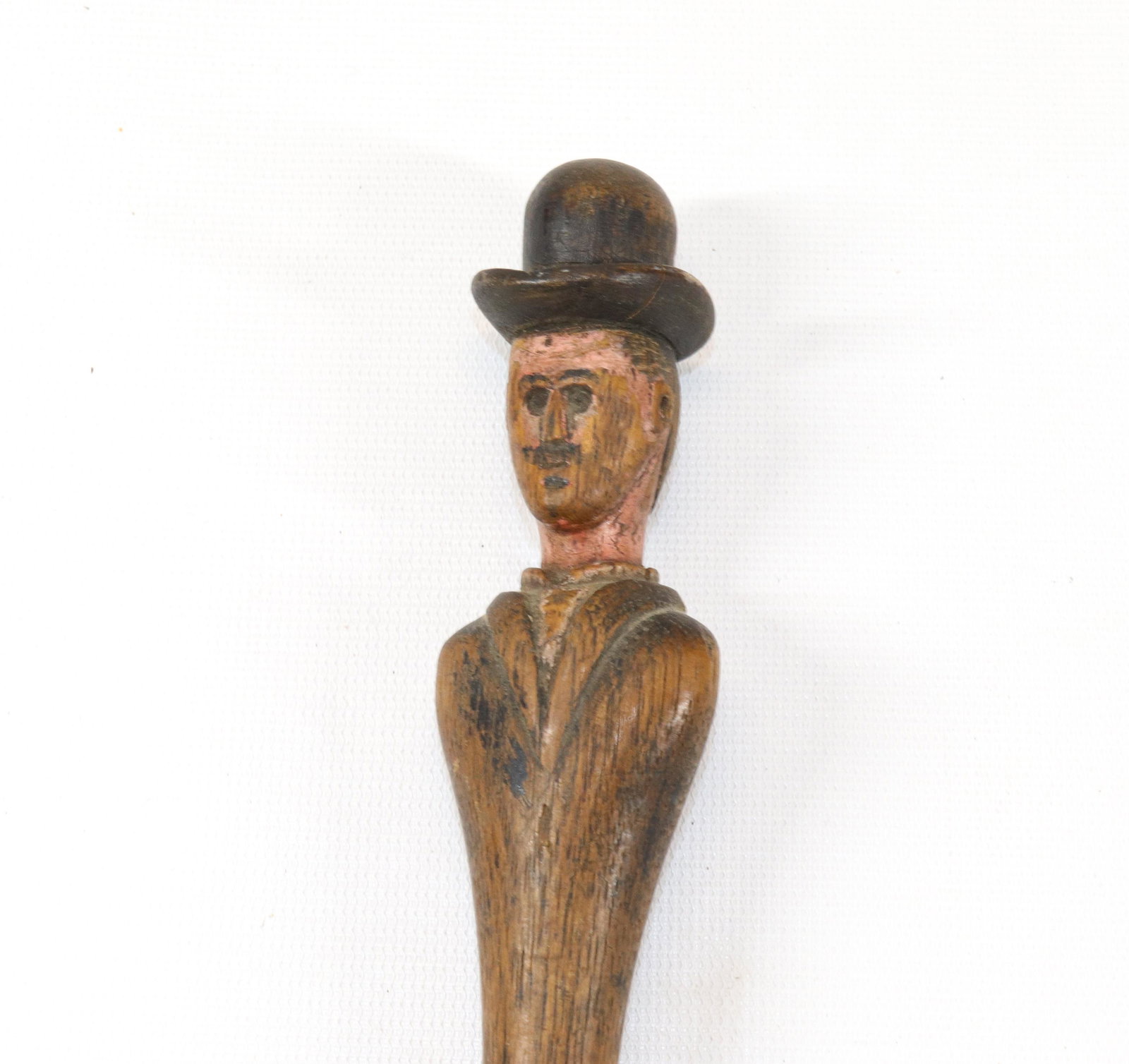 FOLK ART CARVED CANE: MAN WITH BOWLER HAT. PAINTED SURFACE. Size: 34 3/4" L