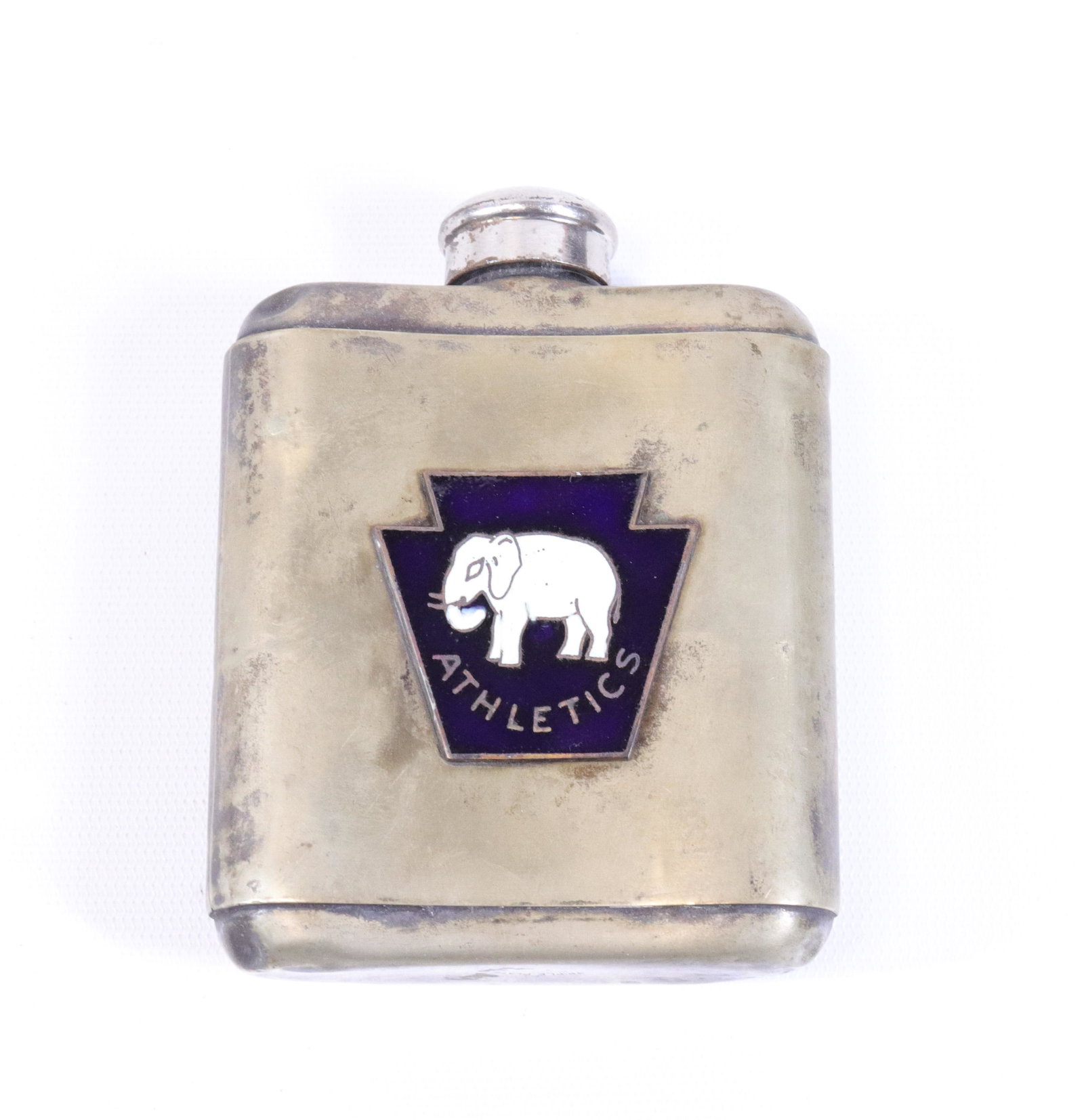 PHILADELPHIA ATHLETICS TRIPLE PLATE FLASK: GLASS INTERIOR WITH SCREW-ON CAP. BLUE KEYSTONE SHAPED ENAMEL EMBLEM WITH ELEPHANT AND "ATHLETICS" Size: 4" X 3 1/2"