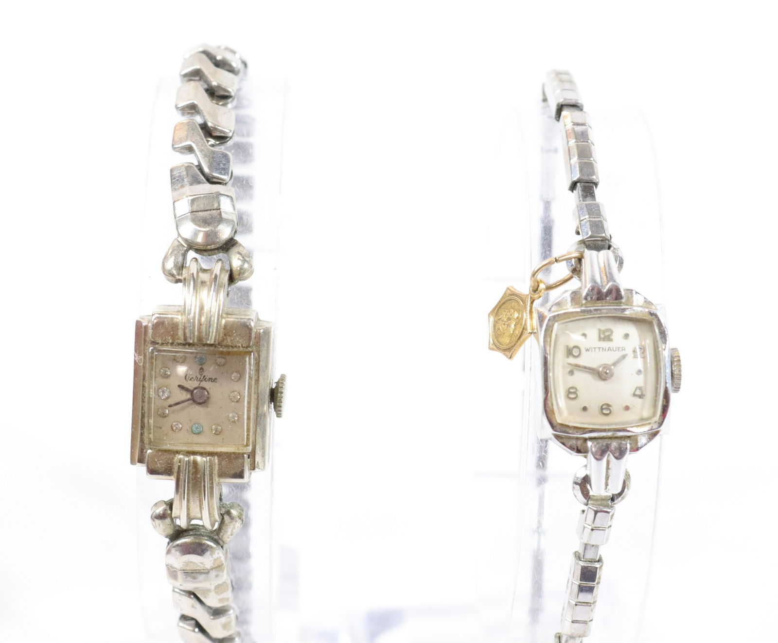 PAIR OF 14KT. GOLD LADIES WATCHES: ONE MRKD. WITTNAUER HAS 18KT. GOLD RELIGIOUS CHARM ATTACHED AND OTHER MRKD. VERIFINE. PLATED BANDS. Size: