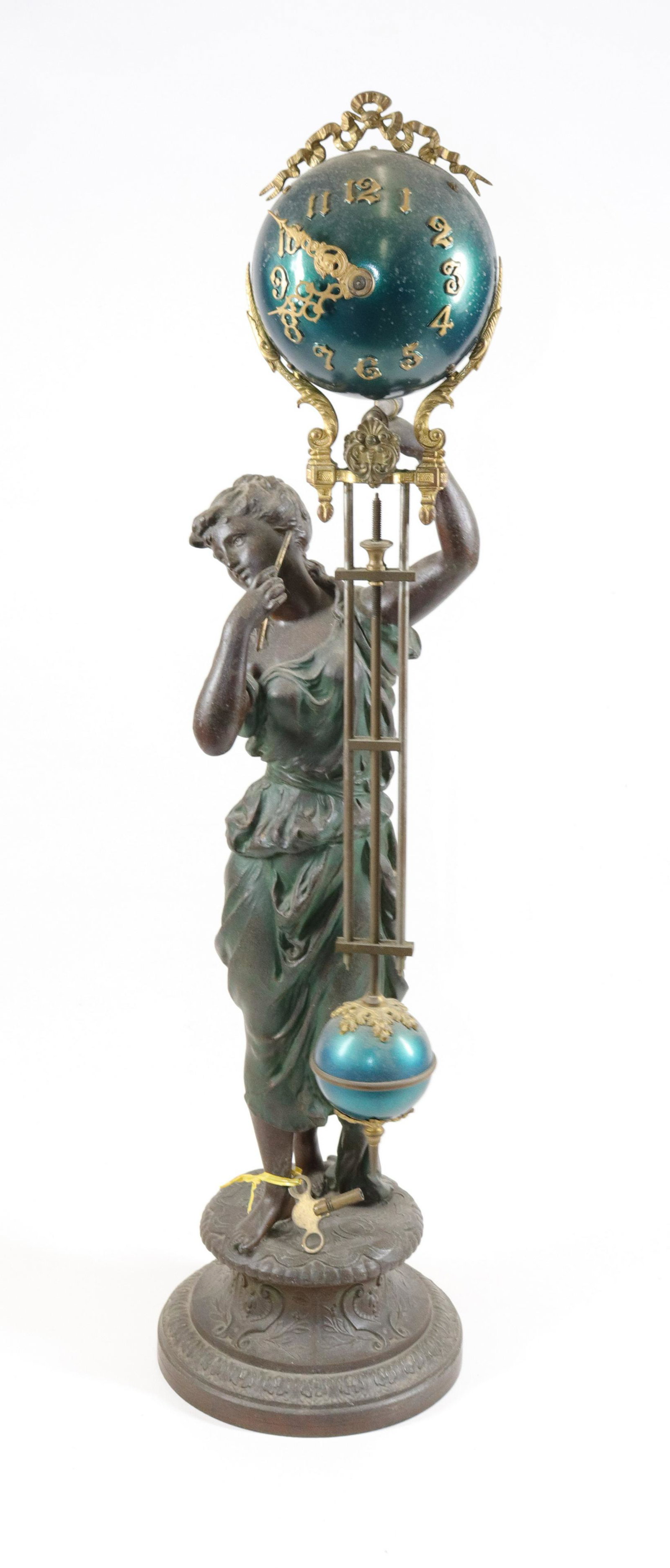ANSONIA "JUNO" FIGURAL MYSTERY CLOCK: PATINATED SPELTER WITH SWINGING BALL MYSTERY CLOCK. WITH KEY Size: 28" H