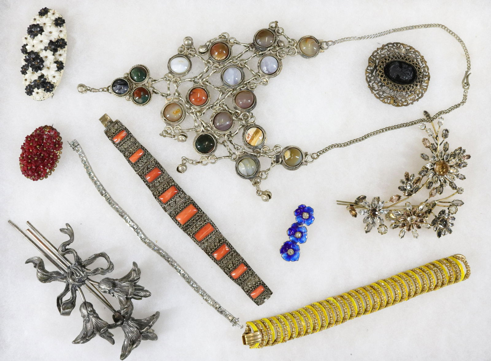 COSTUME AND SILVER JEWELRY LOT: STERLING TRIFARI BRACELET, CHINESE SILVER BRACELET, TREMBLER BROOCH, AND LARGE LILY BROOCH