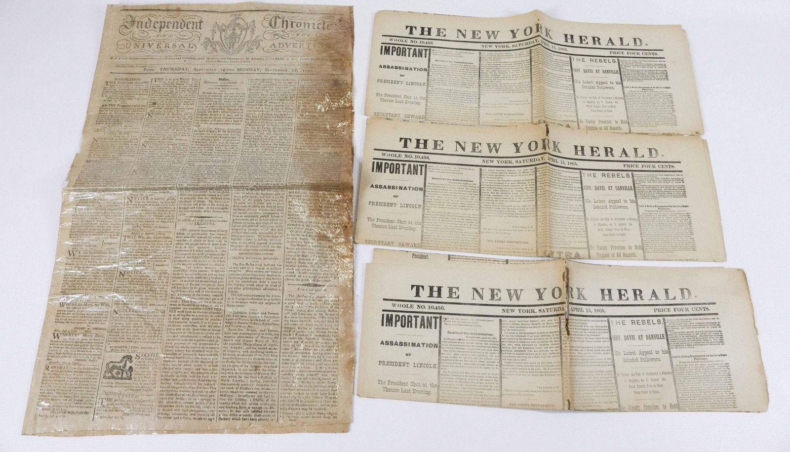 1797 NEWSPAPER AND THREE COPIES OF LINCOLN: THE INDEPENDENT CHRONICLE AND THE UNIVERSAL ADVERTISER, SEPT. 18, 1797 NEWSPAPER (LAMINATED SURFACE) AND THREE FACSIMILE COPIES OF THE NEW YORK HERALD, APRIL 15, 1865 NEWSPAPER EDITION OF ABRAHAM LINC