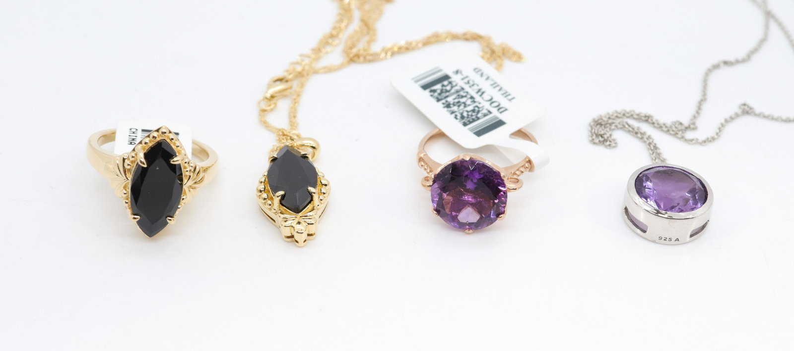 CONTEMPORARY JEWELRY LOT: NEW IN BOX - (4) PIECES INCLUDING - (2) RINGS AND (2) NECKLACES - BLACK SPINEL RING AND MATCHING NECKLACE - AMETHYST RING AND NECKLACE SIZE 8 - CHAIN 16"