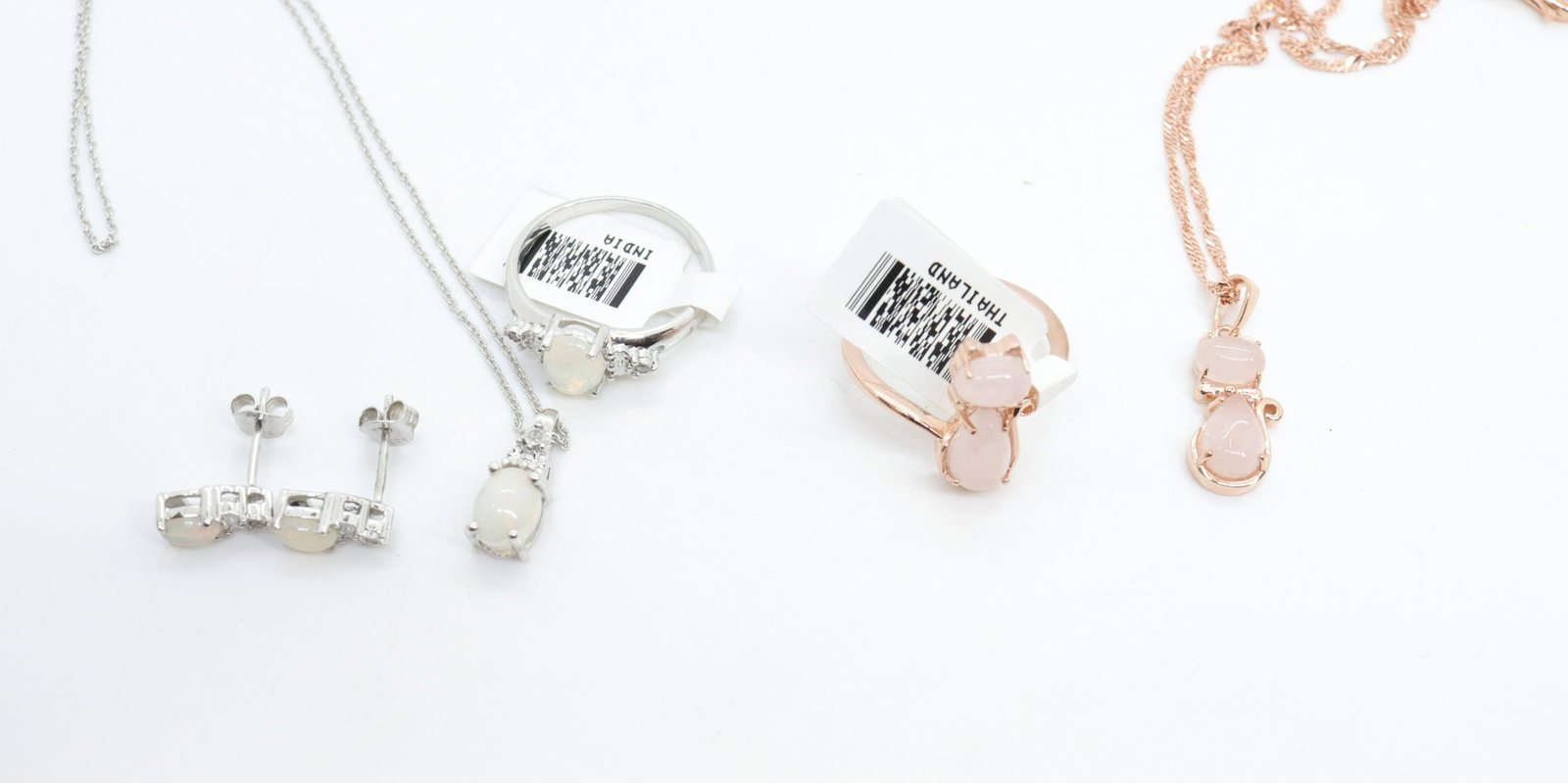 CONTEMPORARY JEWELRY LOT: NEW IN BOX - (5) PIECES INCLUDING - CAT NECKLACE AND RING IN ROSE GOLD PLATED SILVER WITH RING EARRINGS AND NECKLACE IN STERLING SILVER - ALL WITH ETHIOPIAN MOONSTONES SIZE 8 RINGS - 16" NECKLACES