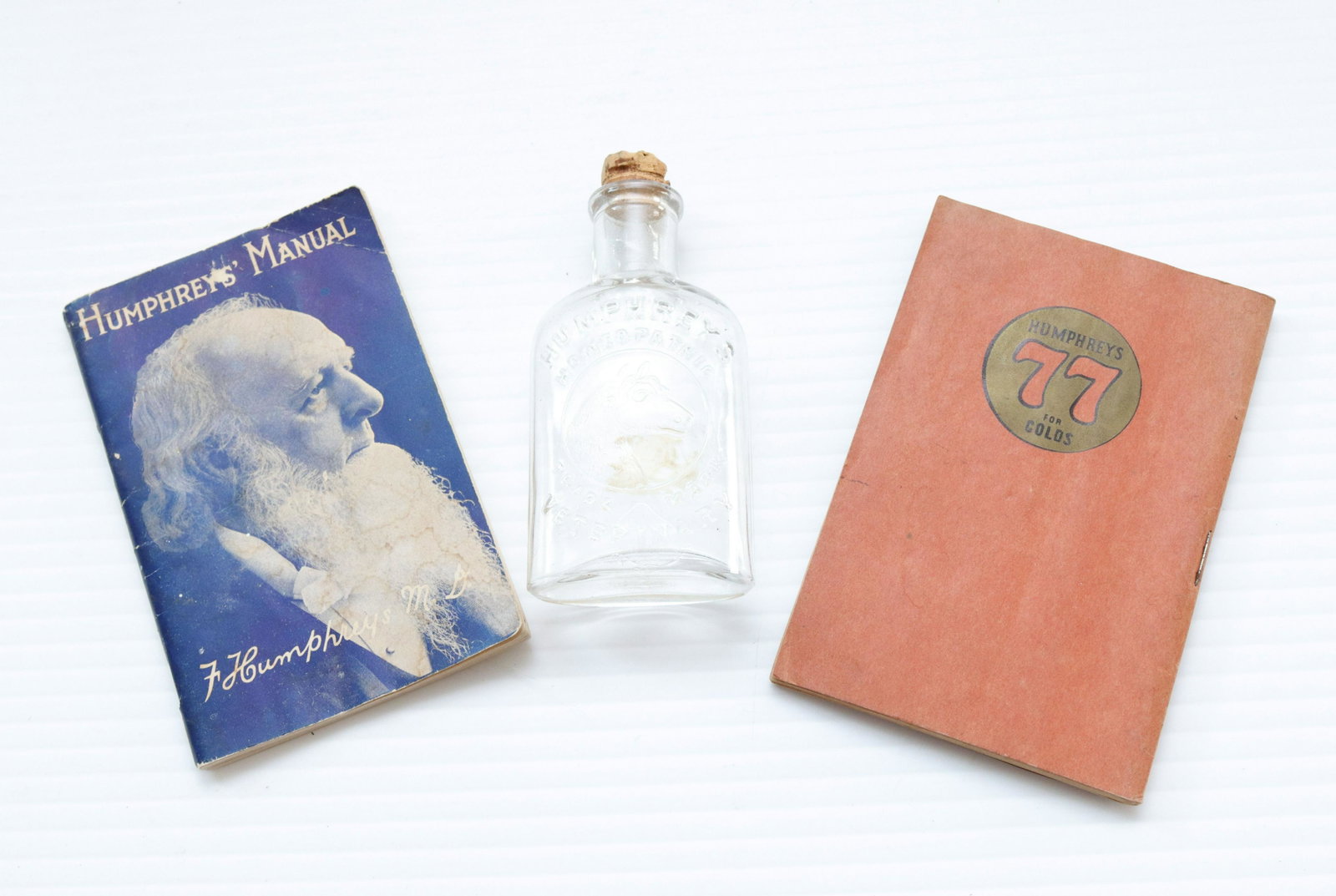 Group lot of humphrey's remedies items: Description: (2) manuals 1930 & 1942 - embossed bottle with horse head Condtion: Wear consistent with age and use Size: BOTTLE 3 1/2" Consignor: JS Terms: This is an On-Site Online Only Auction.