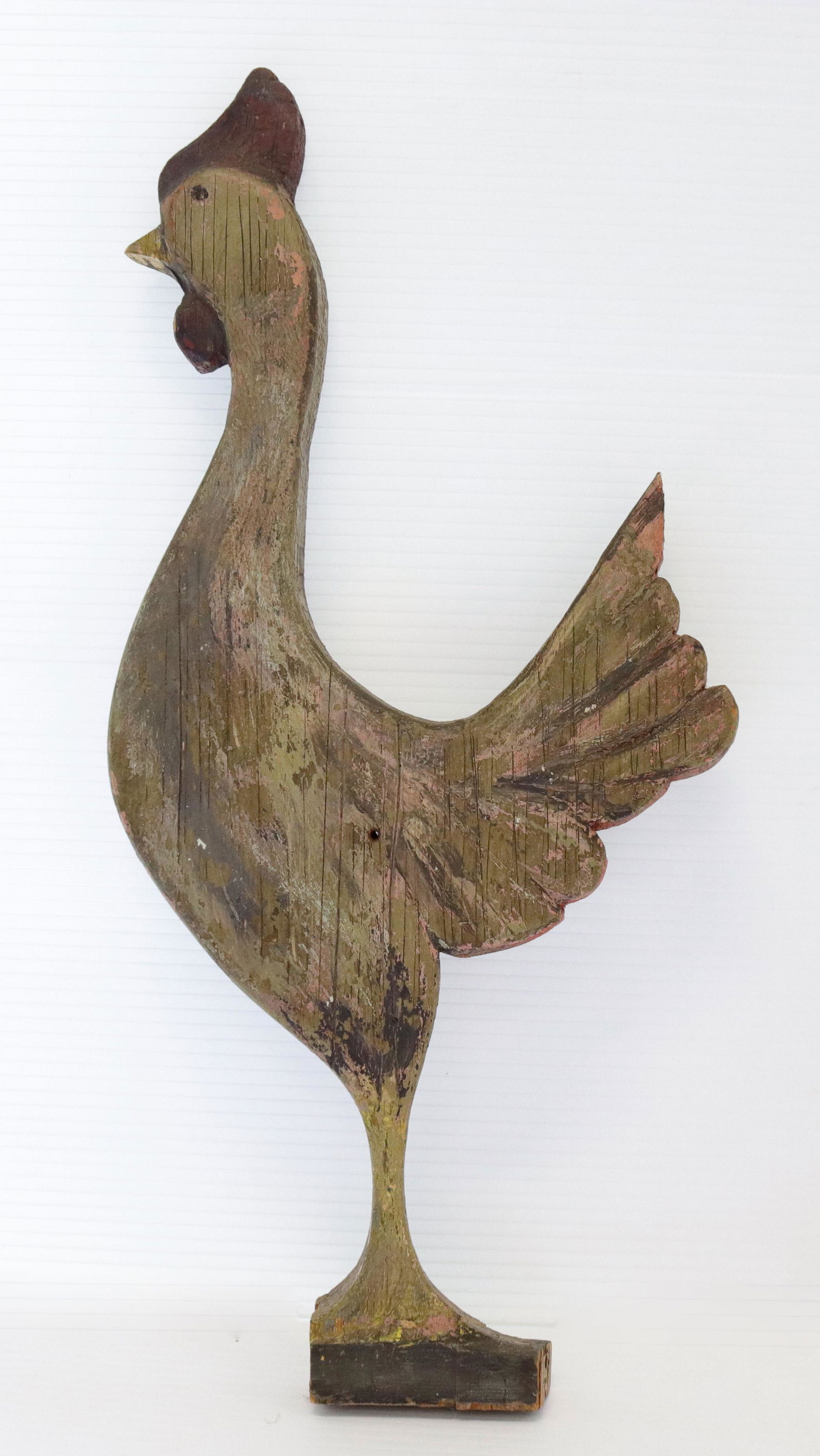 Painted wooden rooster: Description: Folk art wooden rooster with painted surface Condtion: Loss at bottom wear to painted surface Size: 19" H Consignor: JS Terms: This is an On-Site Online Only Auction. Preview Will Be