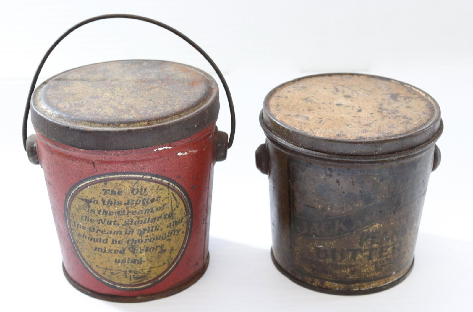 Pr. of vintage advertising peanut butter tins: Description: Buffalo brand and jack & jill - tin lithograph tins with bail handles Condtion: Wear and denting to surface - jack and jills missing handle Size: 3 1/4" AND 3 1/2" H Consignor: JS Terms: