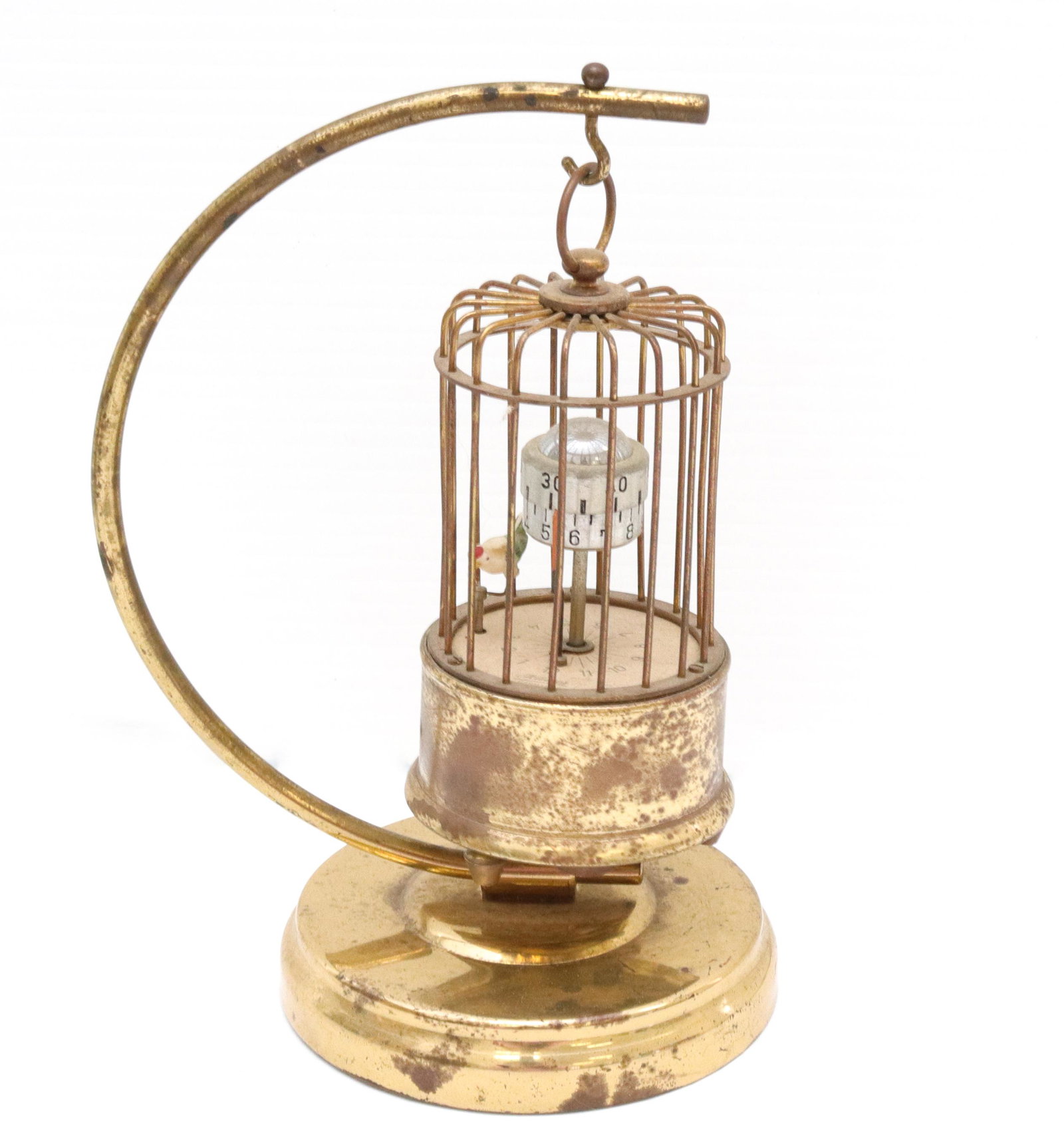 Brass automaton bird cage alarm clock: Description: Hanging bird cage automaton marked "j. kaiser, germany" Condtion: Working order - wear to brass surface Size: 7 3/4" H Consignor: JS Terms: This is an On-Site Online Only Auction. Pre