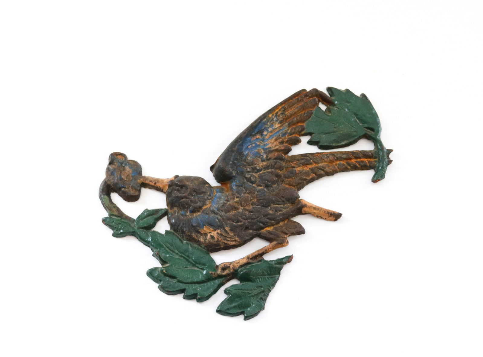 Cast iron bird plaque: Description: Painted surface marked "pat" on reverse Condtion: Wear consistent with age and use Size: 7" L Consignor: JS Terms: This is an On-Site Online Only Auction. Preview Will Be (2) Days and
