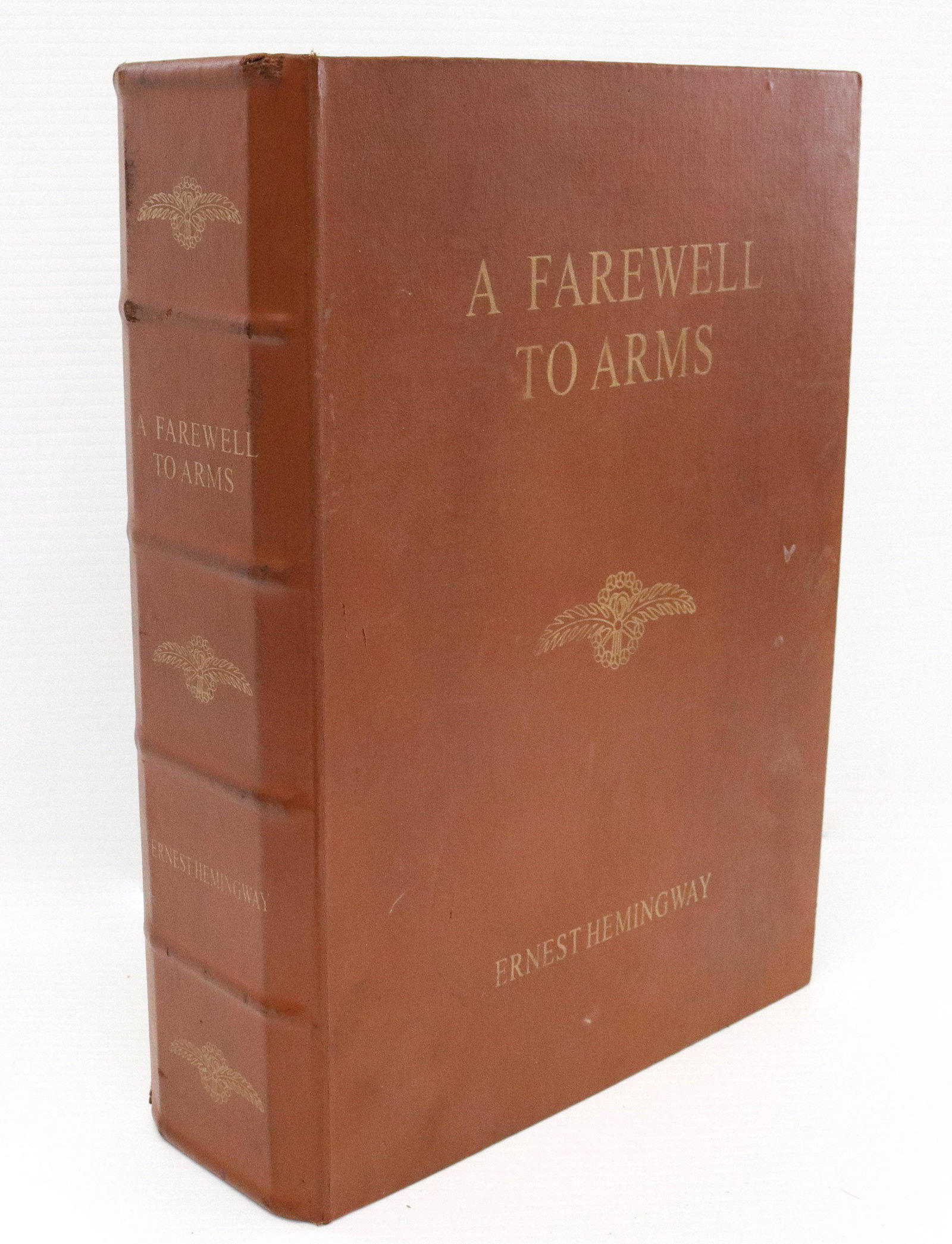 Ernest hemingway book shaped box: Description: "a farewell to arms" - lift lid with lined interior Condtion: Good overall condition Size: 3 3/4" X 10 1/2" Consignor: JS Terms: This is an On-Site Online Only Auction. Preview Will