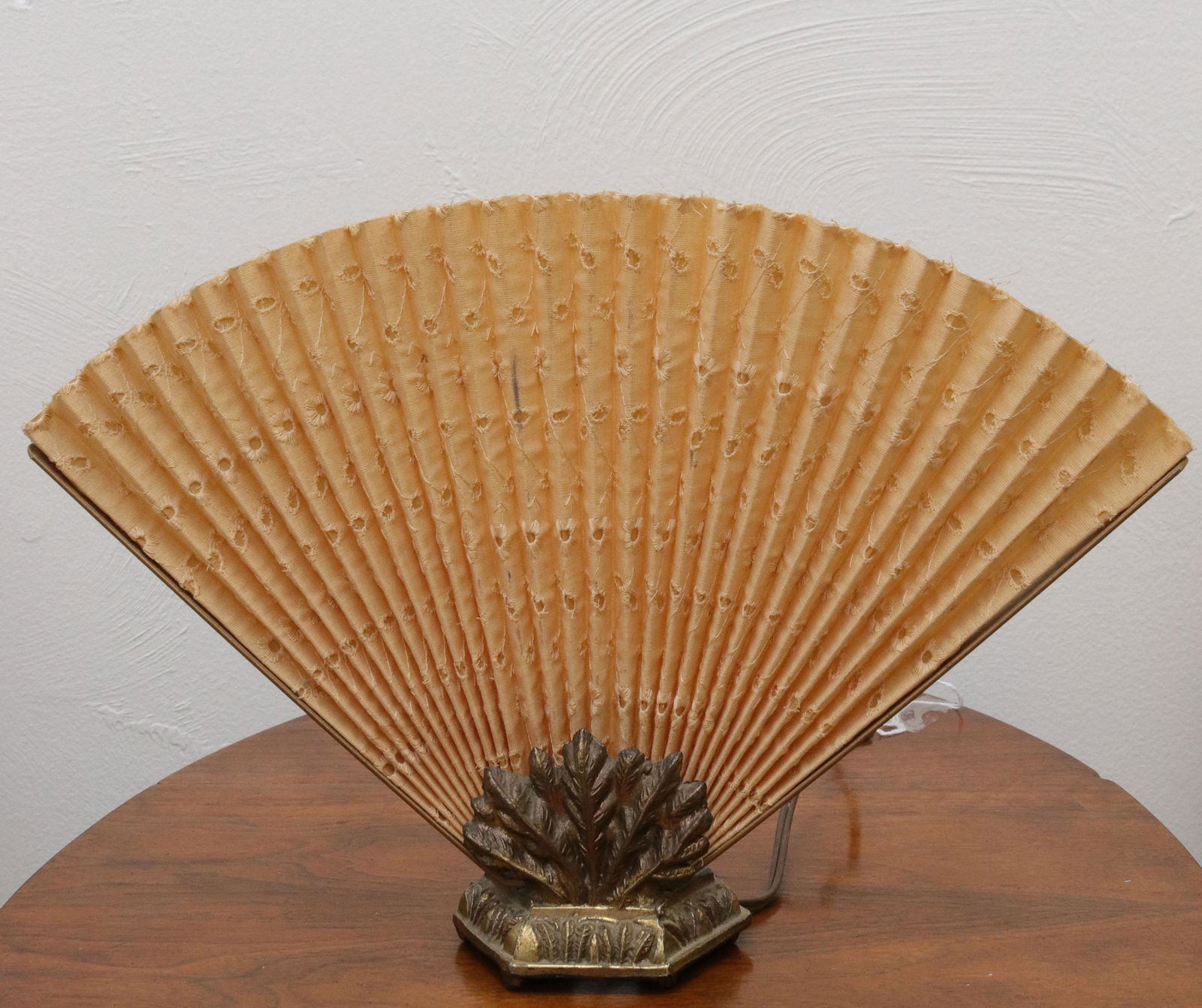 Art deco fan style boudoir lamp: Description: Brass base with cloth fan Condtion: Light wear Size: 10" X 14 1/2" Consignor: JS Terms: This is an On-Site Online Only Auction. Preview Will Be (2) Days and you must Make an Appoinme