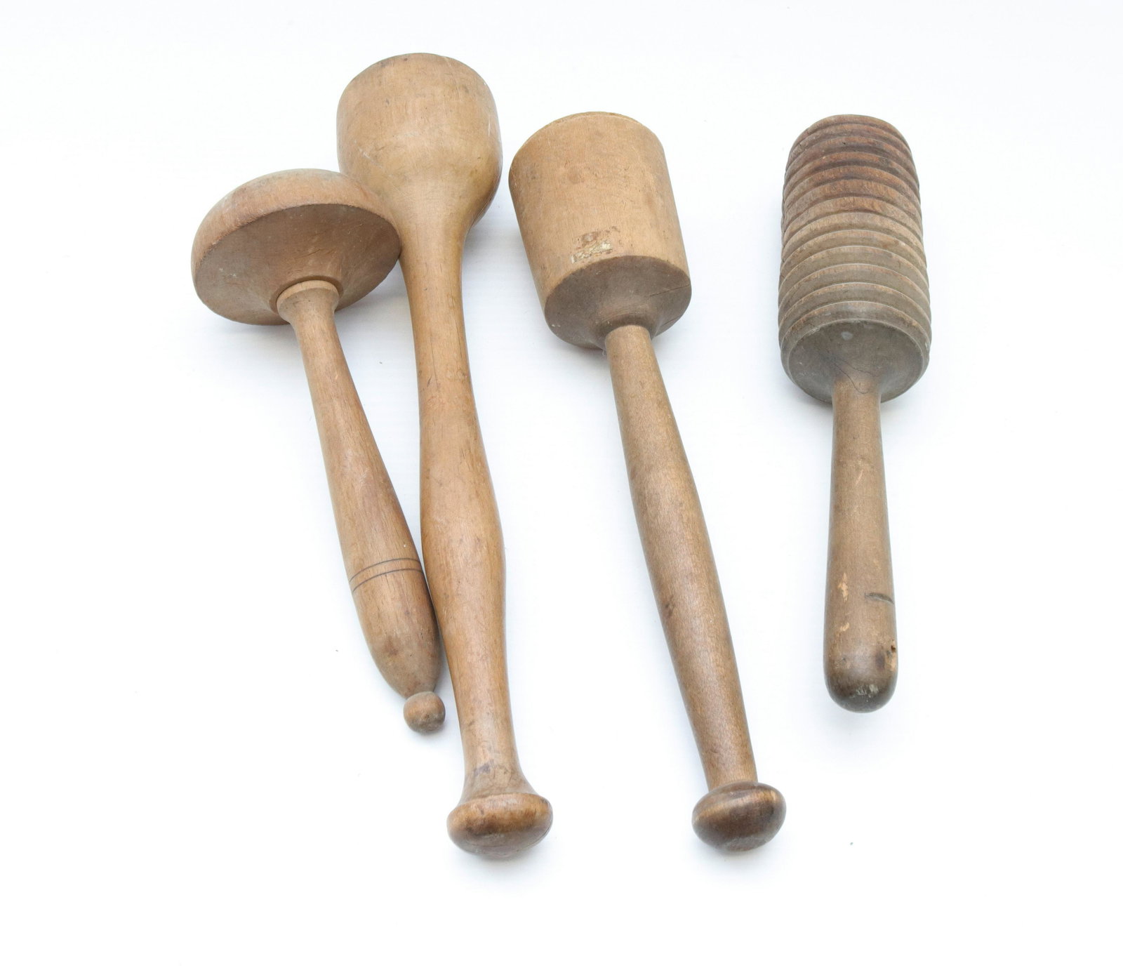 Antique wooden "masher" or "stomper" lot: Description: (4) primitive wooden mashers Condtion: Original surface Size: 15" LARGEST Consignor: JS Terms: This is an On-Site Online Only Auction. Preview Will Be (2) Days and you must Make an Ap