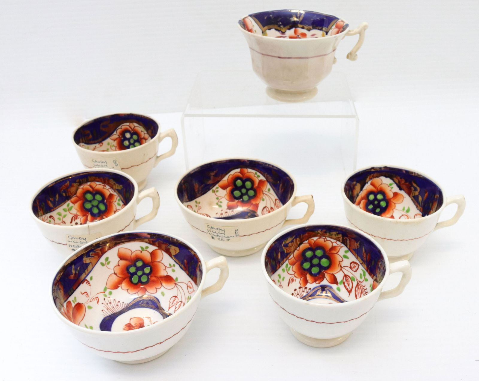 Lot of gaudy welsh porcelain: Description: (7) pieces including - assorted handled tea and coffee cups Condtion: One handle missing piece - some hairlines and minor staining Size: Consignor: JS Terms: This is an On-Site Online