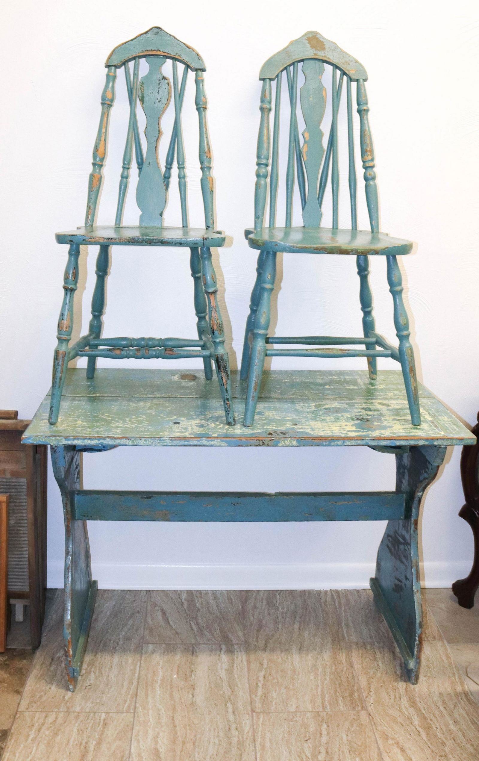 Primitive paint decorated table and chairs: Description: Blue and green painted wooden farm table with pair of matching chairs Condtion: Wear to painted surface Size: CHAIRS 39" X 16" X 17 1/2" - TABLE 30" X 42" X 23 1/2" Consignor: JS Terms:<b