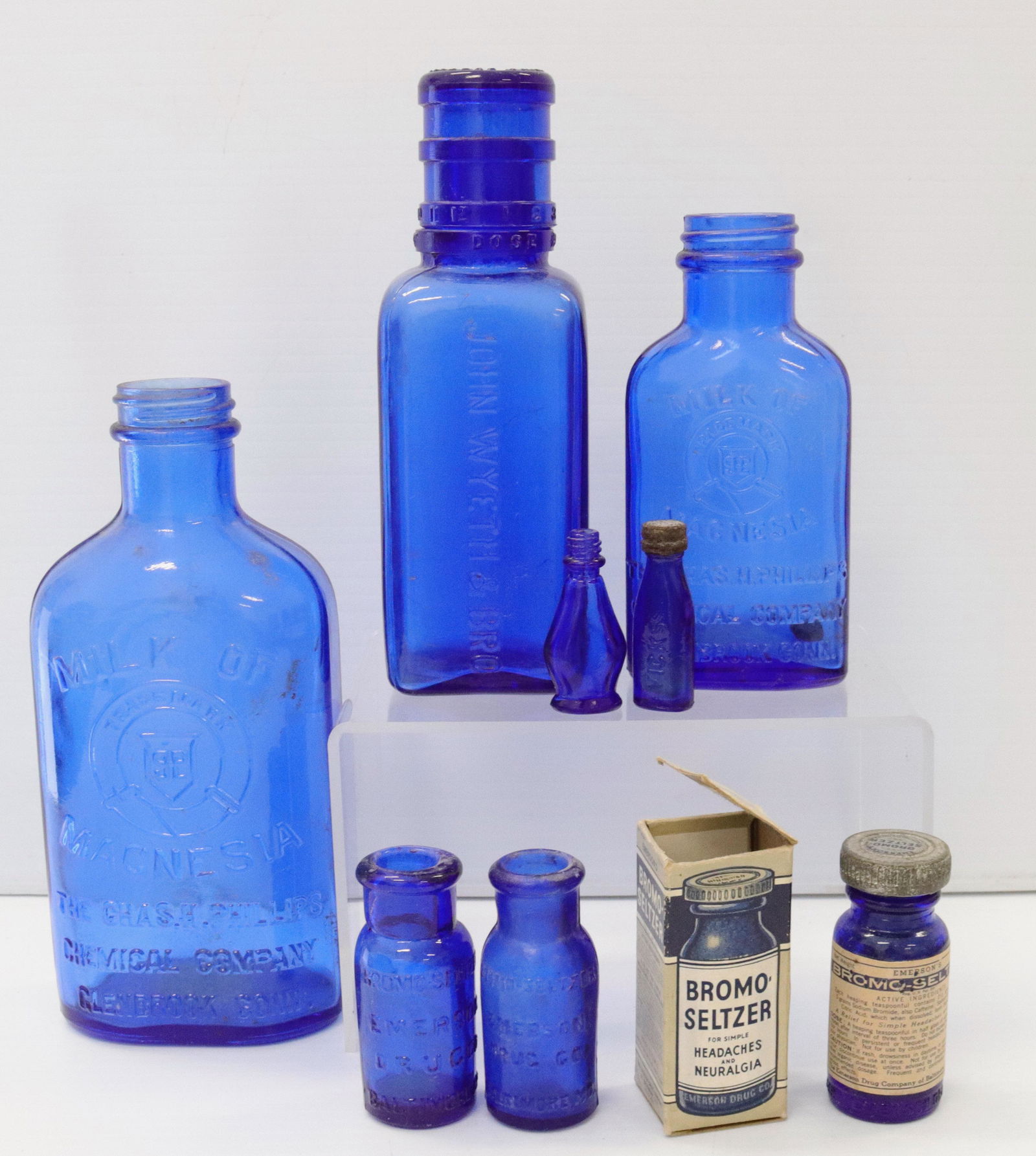Group lot of cobalt blue medicine bottles: Description: (8) embossed bottles including - milk of magnesia, john wyeth, bromo seltzer, and more Condtion: Wear consistent with age and use Size: 2" TO 6 3/4" Consignor: JS Terms: This is an On