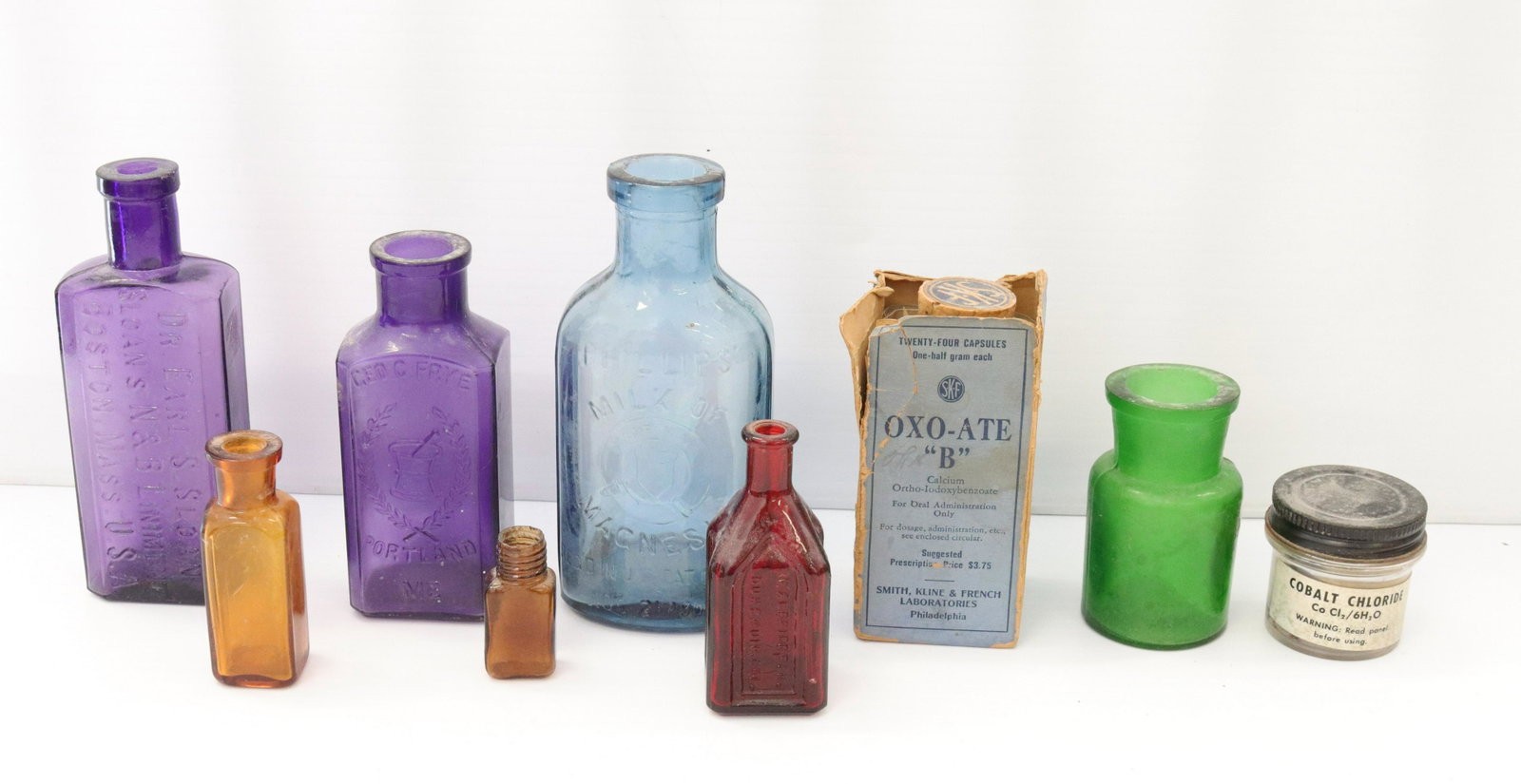 Group lot of vintage glass bottles: Description: (9) glass bottles including - (2) purple bottles one marked "dr. sloan" boston, mass and other marked "george frye" portland, me - and others Condtion: Wear consistent with age and use Si