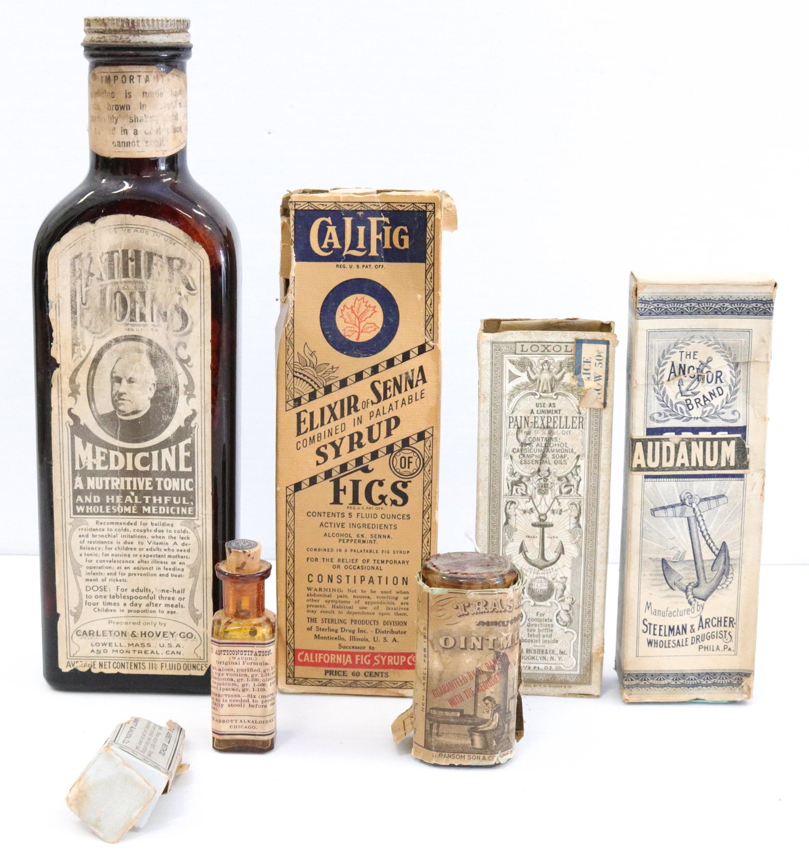 Group lot of vintage medical bottles: Description: (6) with original paper labels and some with original boxes including - father johns, califig, pain-expeller, and more Condtion: Wear consistent with age and use Size: 3" TO 9 1/2" Consig