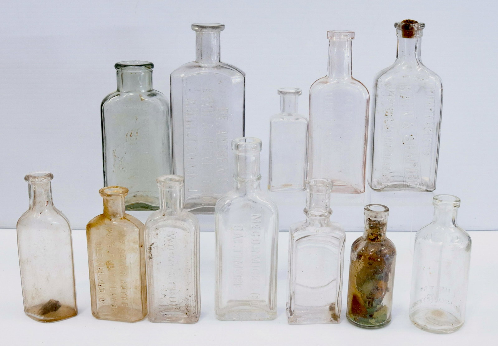 Group lot of vintage medical bottles: Description: (12) embossed bottles including - dr. andrews morristown, new jersey - kemps balsam - whittemore boston, mass - and more Condtion: Wear consistent with age and use Size: 3 1/2" TO 6 3/4" 