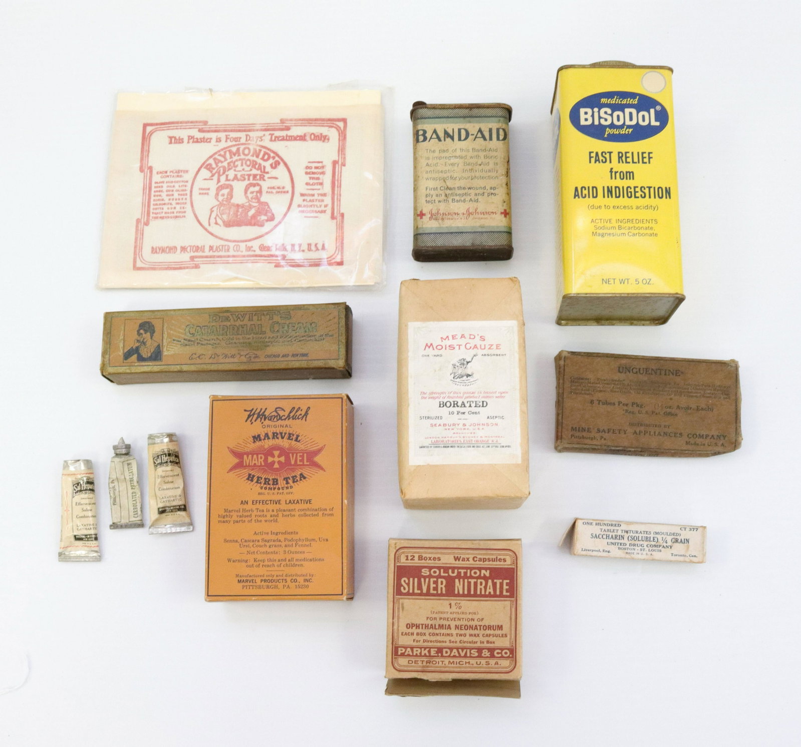 Group lot of household products: Description: Vintage products including - band aid tin, meads moist gauze, dewitts catarrhal cream, and more Condtion: Wear consistent with age and use Size: 2" TO 5 1/2" Consignor: JS Terms: This