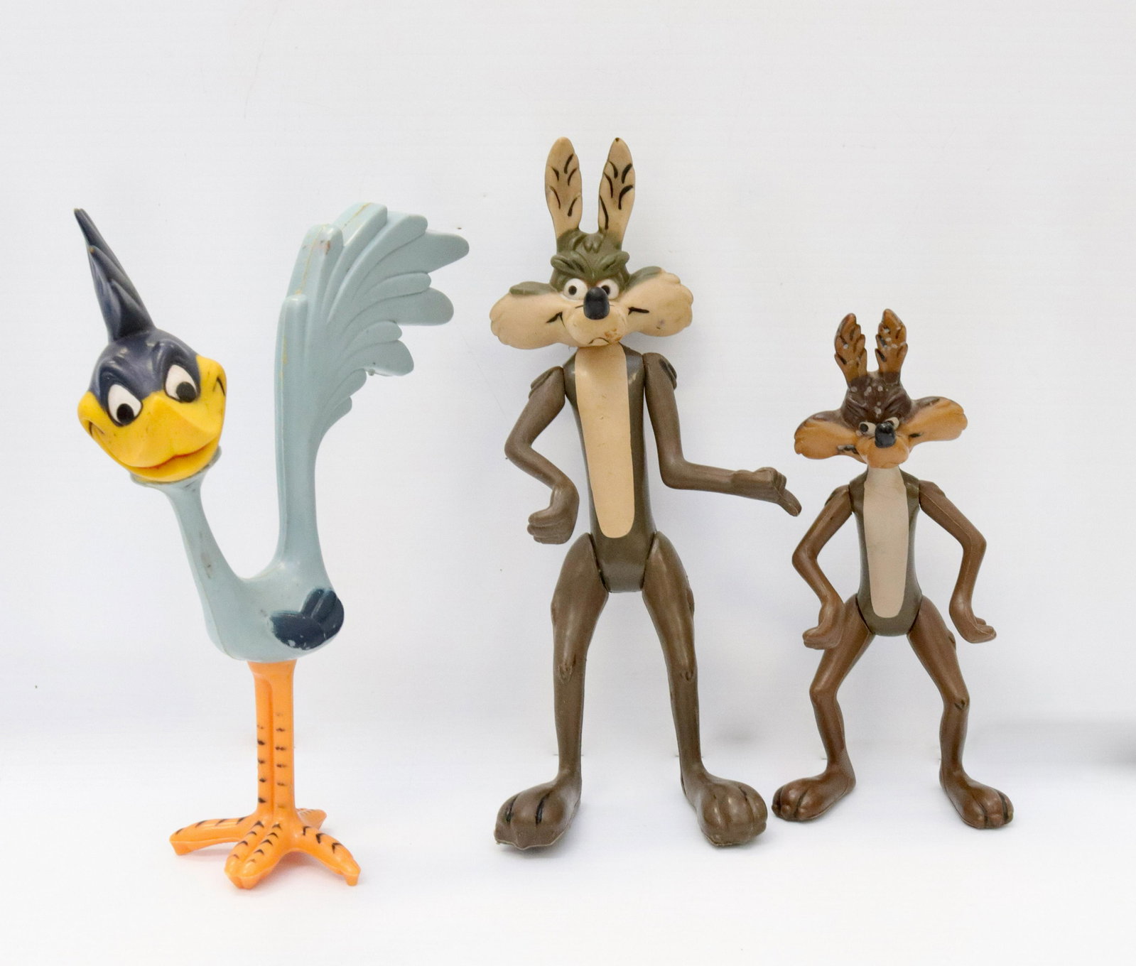 Group lot of cartoon character figures: Description: Three including: two wile e coyote and roadrunner. largest mrkd. "warner brothers 1968". road runner mrkd. "warner bros, seven arts inc. 1968" Condtion: Wear from age and use. some fade a