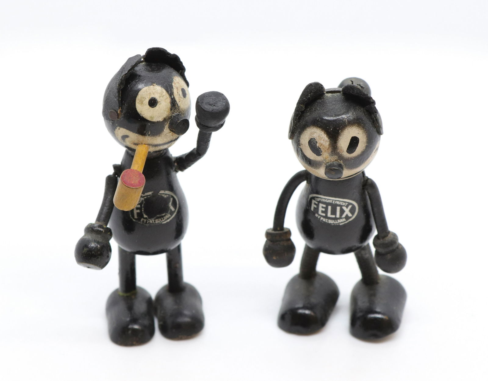 Pr. of early felix the cat figures: Description: Sullivan hand painted and wooden felix the cats with leather ears - one with pipe Condtion: Wear to painted surface Size: 3 1/2" L Consignor: JS Terms: This is an On-Site Online Only