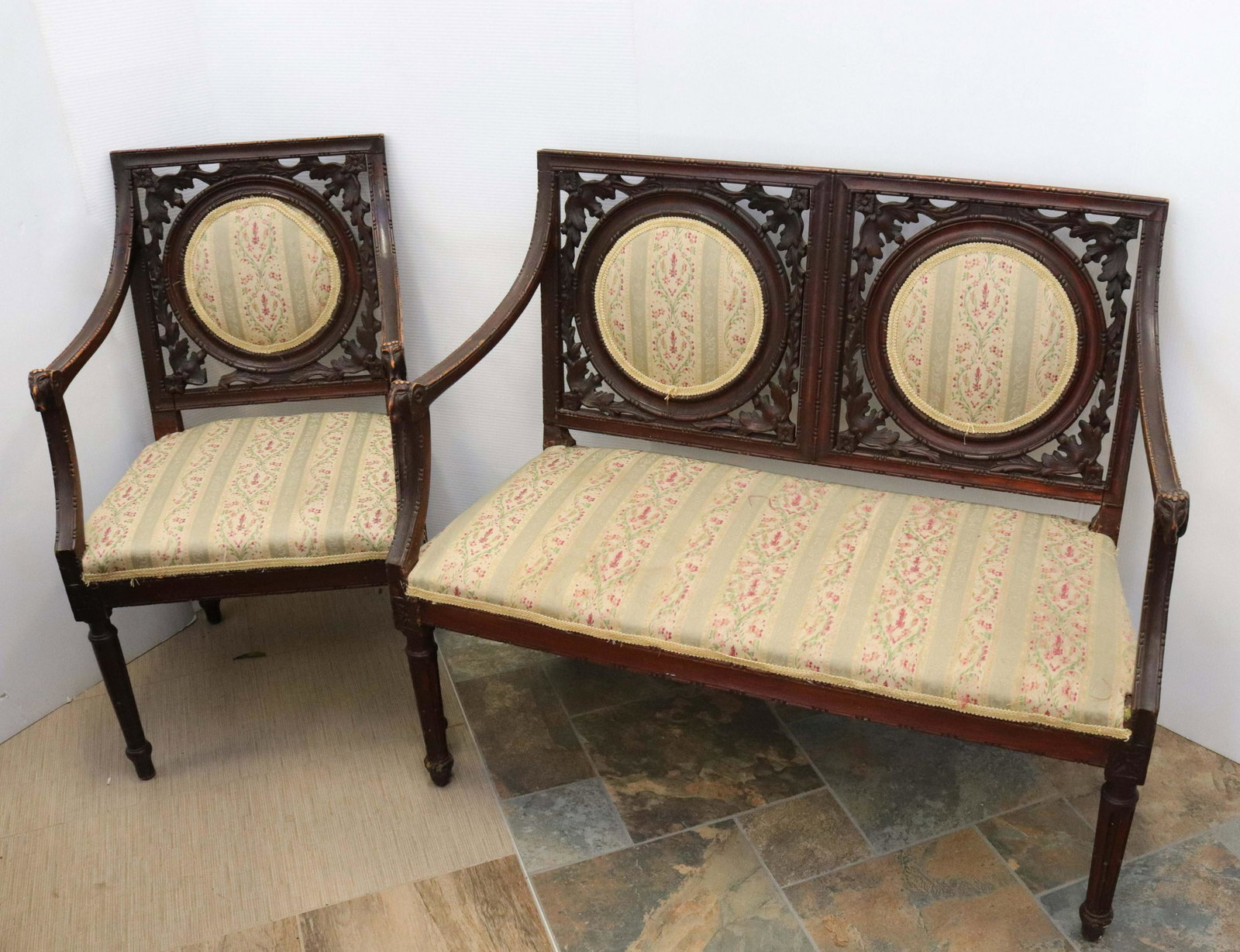 Victorian settee: Description: Floral upholstery - mahogany frame - carved design Condtion: Wear to finish and upholstery Size: 33" X 38 1/2" X 17 1/2" Consignor: JS Terms: This is an On-Site Online Only Auction. P