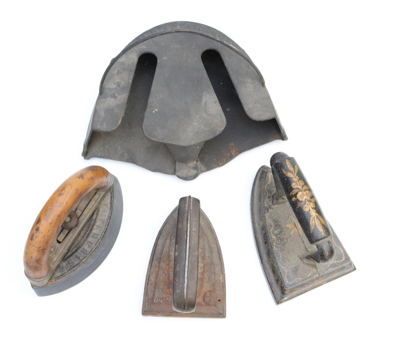 Group lot of early sad irons: Description: (3) antique sad irons and iron heater Condtion: Wear consistent with age and use Size: Consignor: JS Terms: This is an On-Site Online Only Auction. Preview Will Be (2) Days and you m