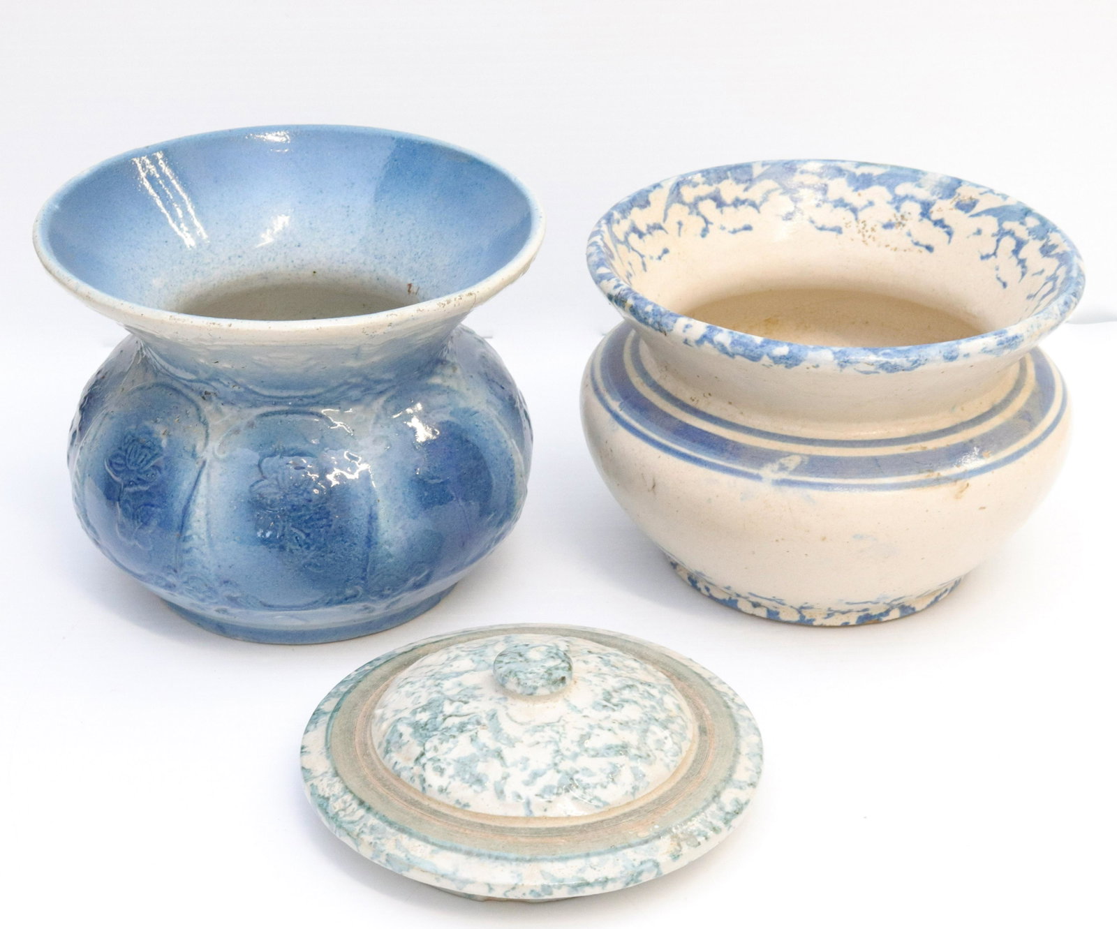 Group lot of stoneware: Description: (3) pieces including - floral decorated spittoon, spongeware spittoon, and spongeware lid Condtion: Wear consistent with age and use Size: 7 1/2" D Consignor: JS Terms: This is an On-S