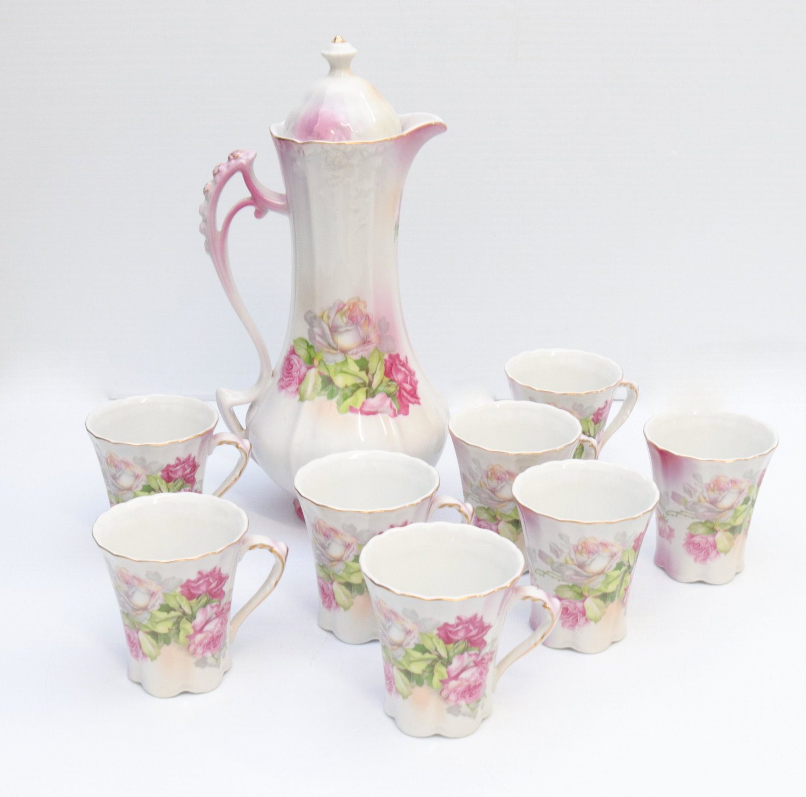 Nippon chocolate set: Description: Transfer of open roses - pot with 8 cups - hand painted nippon with red mark Condtion: Some wear to painted surface Size: 11" AND 5 1/4" Consignor: JS Terms: This is an On-Site Online