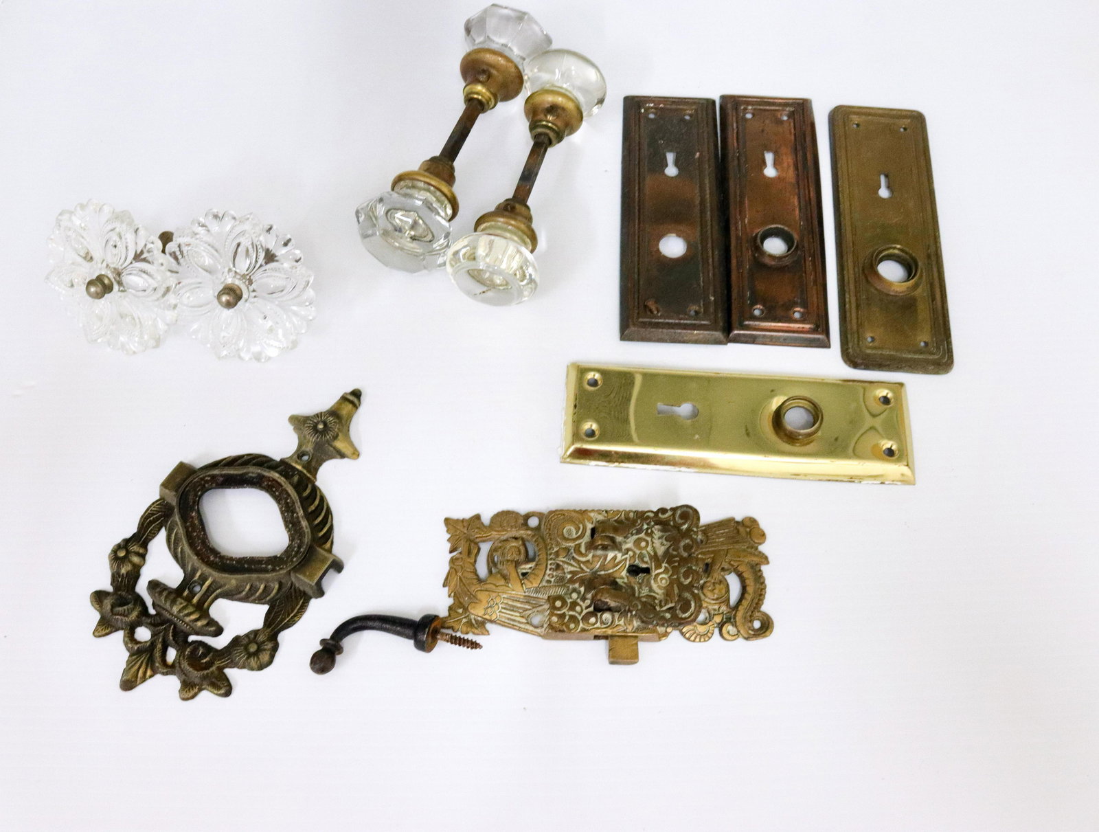 Antique hardware lot: Description: Including - glass door knobs, pr. of curtain tiebacks, fancy victorian latch, and more Condtion: Wear consistent with age and use Size: TIEBACKS 3 1/4" D - DOOR KNOBS 2" TO 2 1/4" D Consi