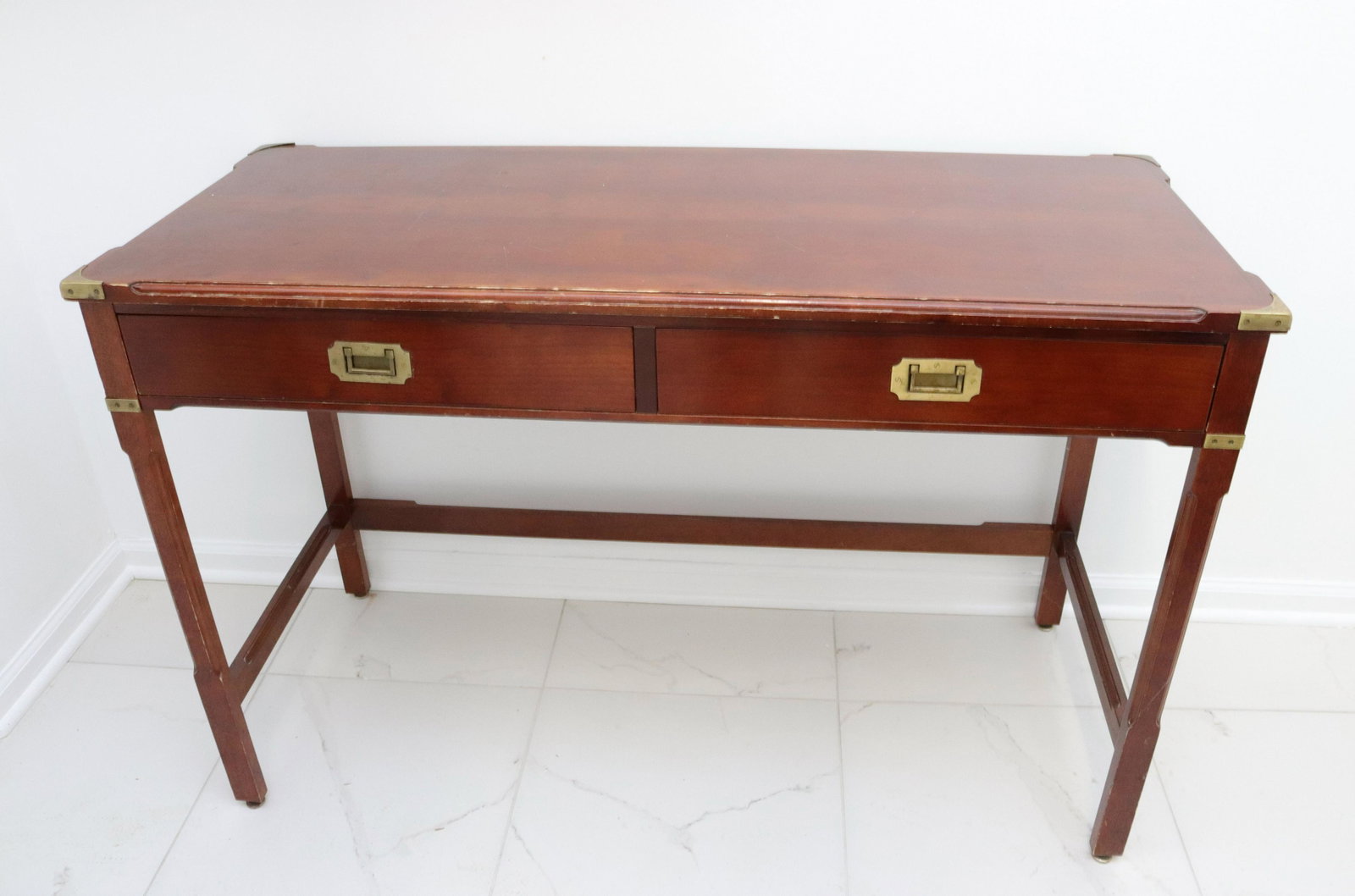 Asian style console table: Description: Two drawers with brass pulls and accents Condtion: Wear consistent with age and use Size: 31 1/2" X 49" X 20 1/2" Consignor: JS Terms: This is an On-Site Online Only Auction. Preview