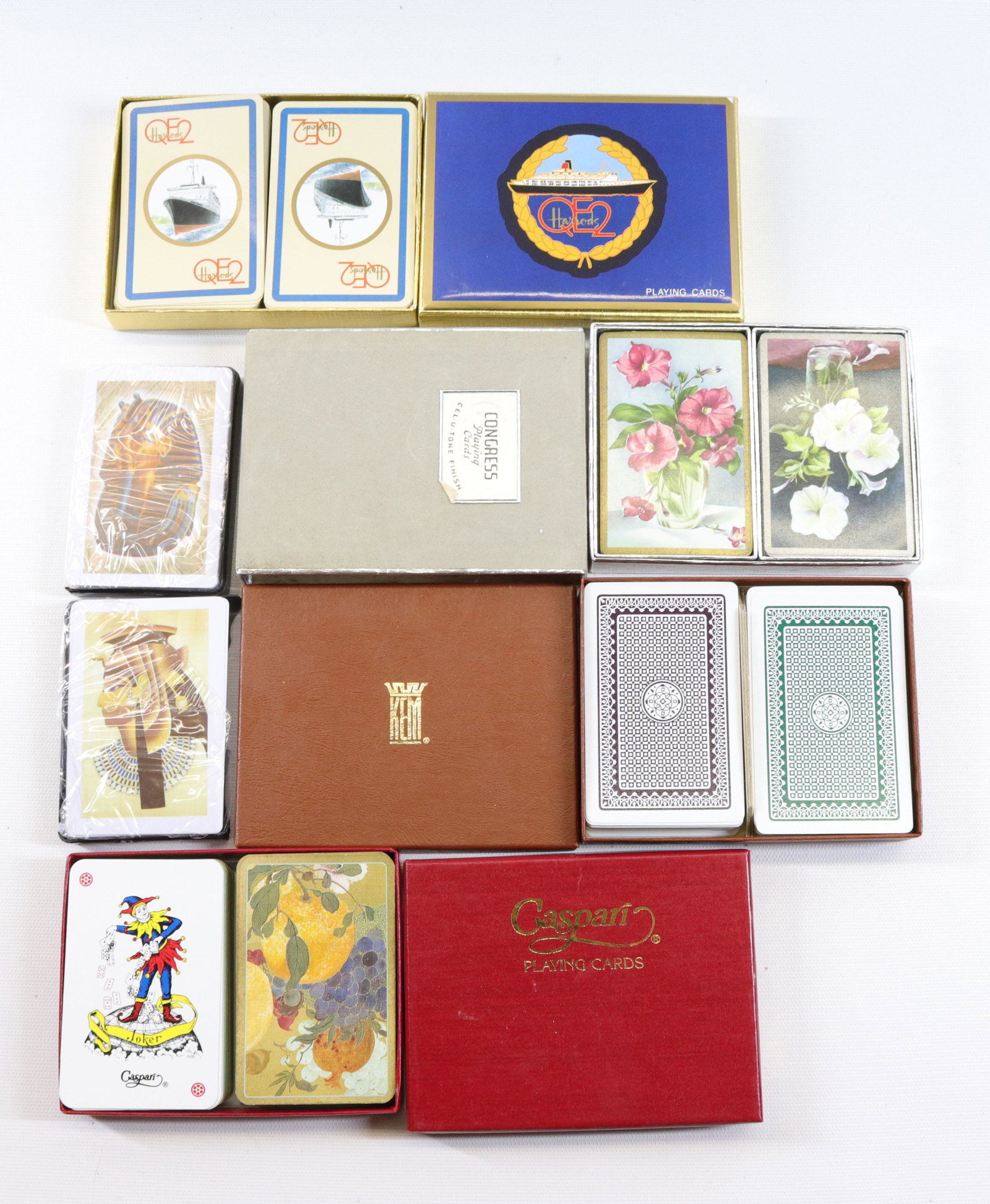 GROUP LOT OF PLAYING CARDS: INCLUDING: HARRODS QE2, CASPARI FRUITS/FLOWERS, CONGRESS FLORAL MOTIF AND MORE