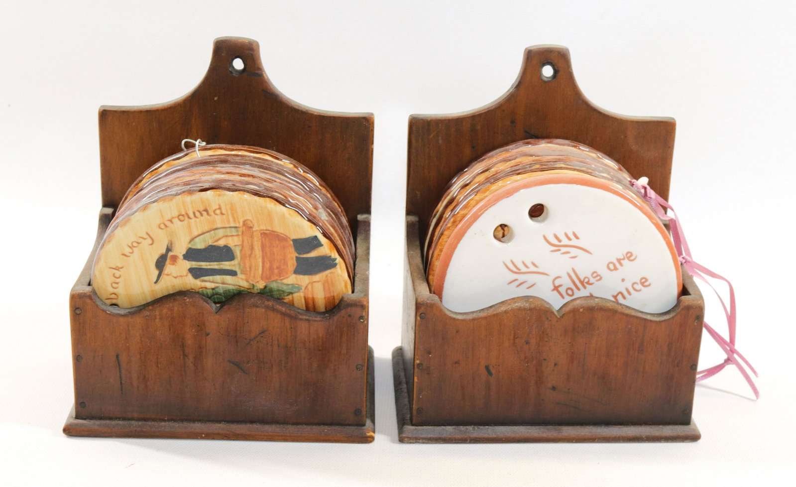 GROUP LOT OF PENNSBURY POTTERY WALL PLAQUES: (13) POTTERY WALL PLAQUES IN WOODEN HOLDERS. ALSO (1) ADDITIONAL PLAQUE Size 4 1/2" D