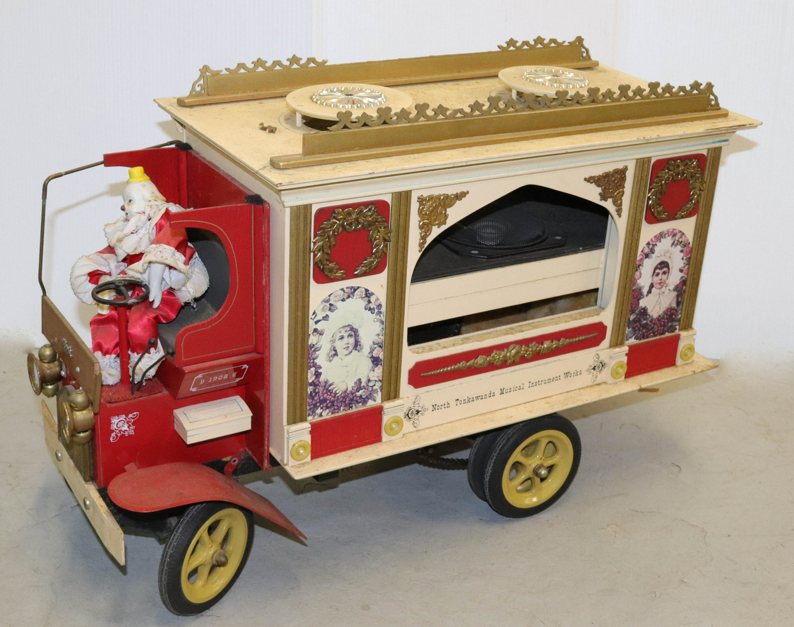 HANDMADE MUSICAL CIRCUS TRUCK: PAINTED WOOD AND METAL WITH CLOWN DRIVER. FITTED WITH SPARKOMATIC RADIO/CASSETTE AND SPEAKERS Size 16 1/2" X 25 1/2"