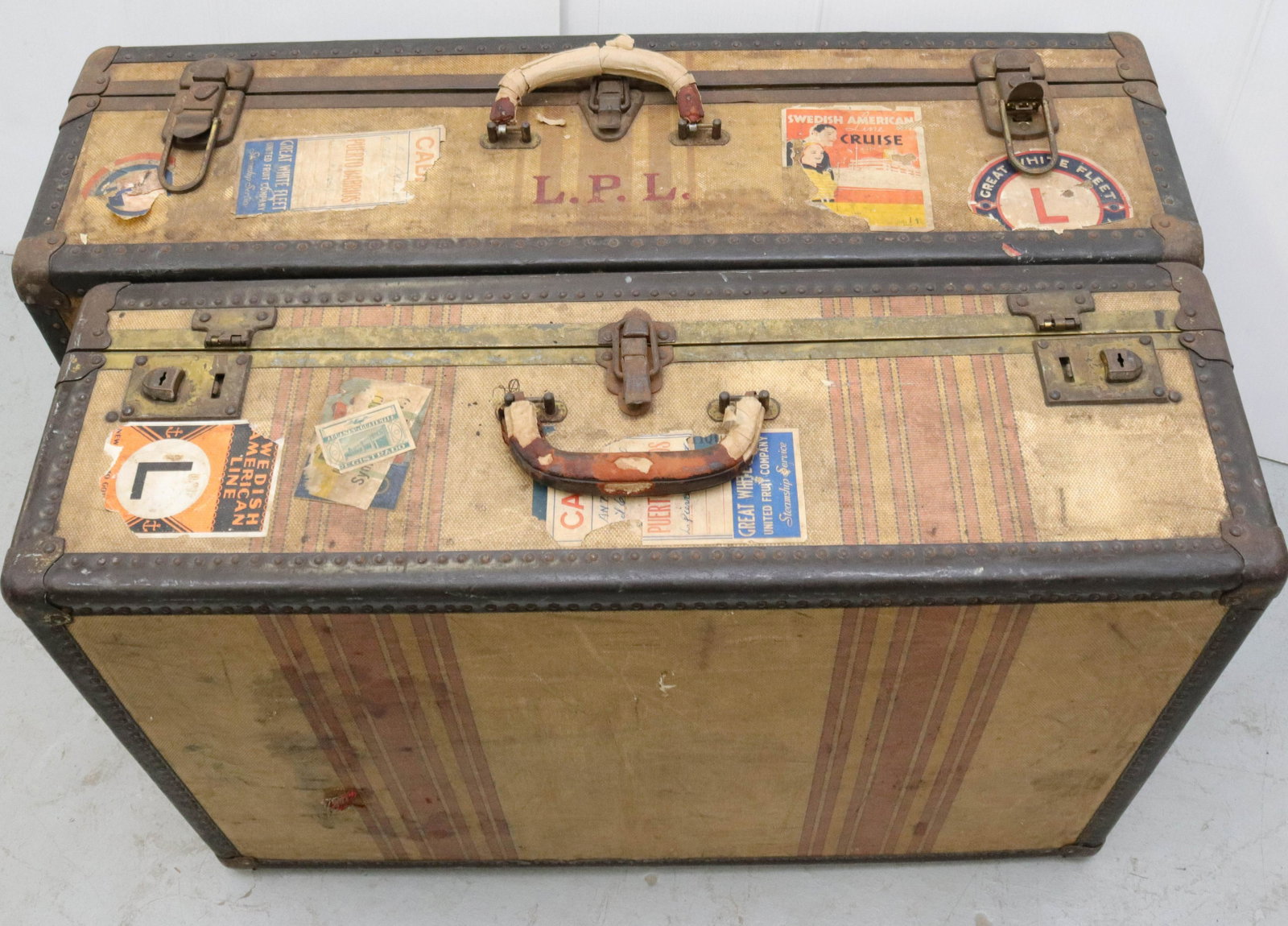 PAIR OF VINTAGE SUITCASES: TRAVEL STICKERS ON OUTSIDE Size 29" X 19 1/2" AND 32" X 19"