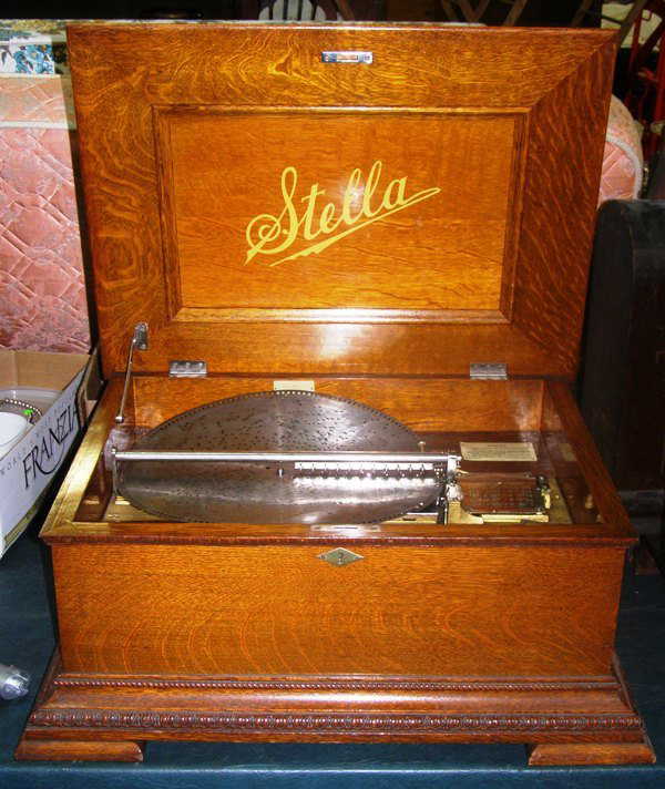 223A STELLA MUSIC BOX IN OAK 14" W/ METAL DISC