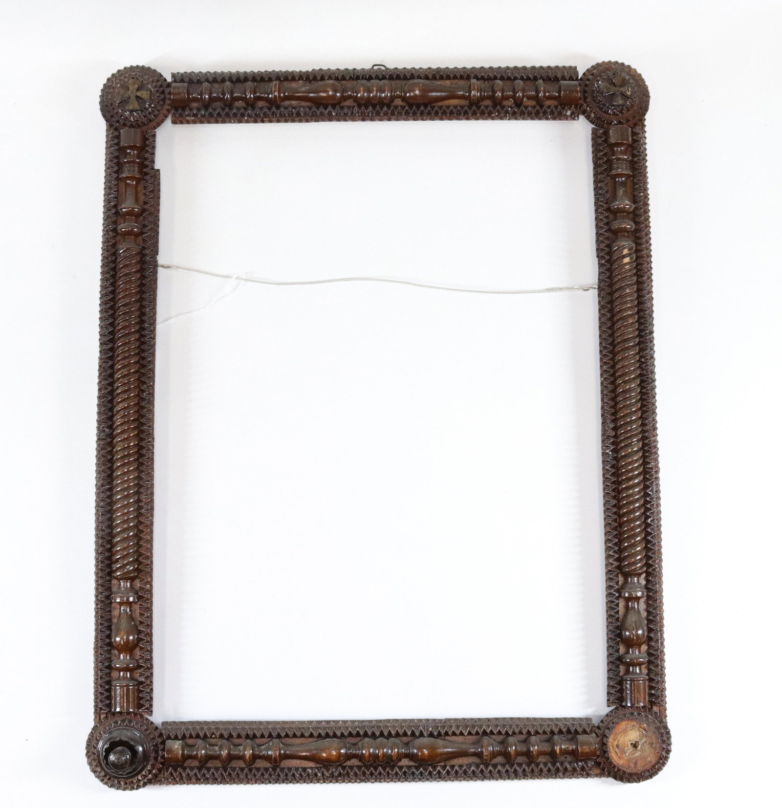 TRAMP ART WOODEN FRAME: CHIP CARVED WITH BALUSTER DECORATION AND DARK STAIN SIZE: INTERIOR SIZE 19 1/2" X 14 1/2" - OVERALL SIZE 23" X 18"