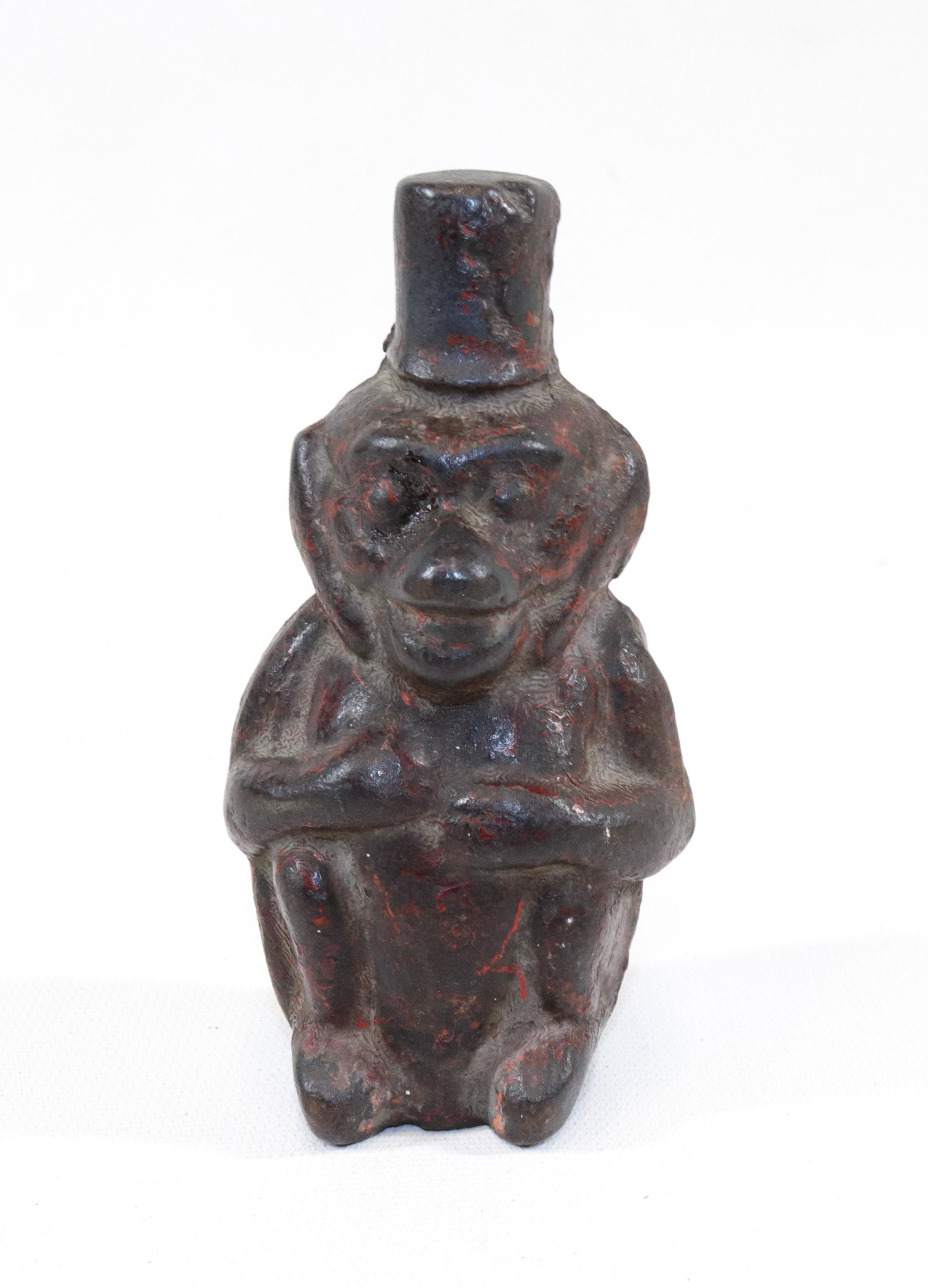CAST IRON MONKEY FIGURE: MONEY WEARING TOP HAT WITH TRACES OF ORIGINAL RED PAINT SIZE: 4 3/4" H