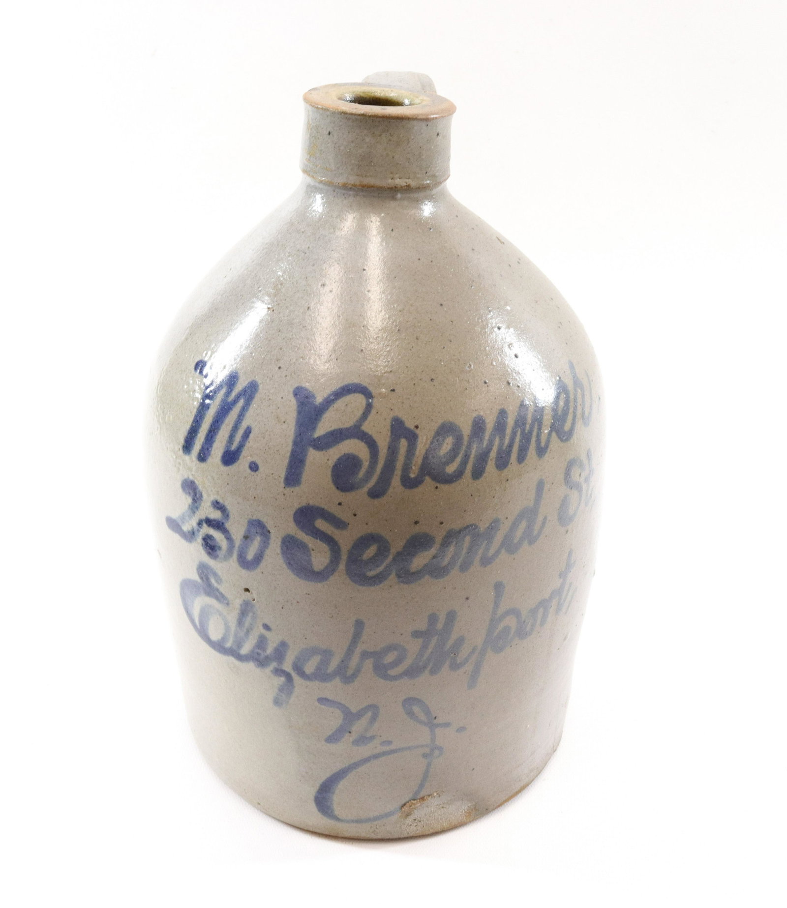 BLUE DECORATED STONEWARE SCRIPT ADVERTISING JUG: MARKED "M. BRENNER, 230 2ND ST. ELIZABETHPORT, NJ" SIZE: 11" H