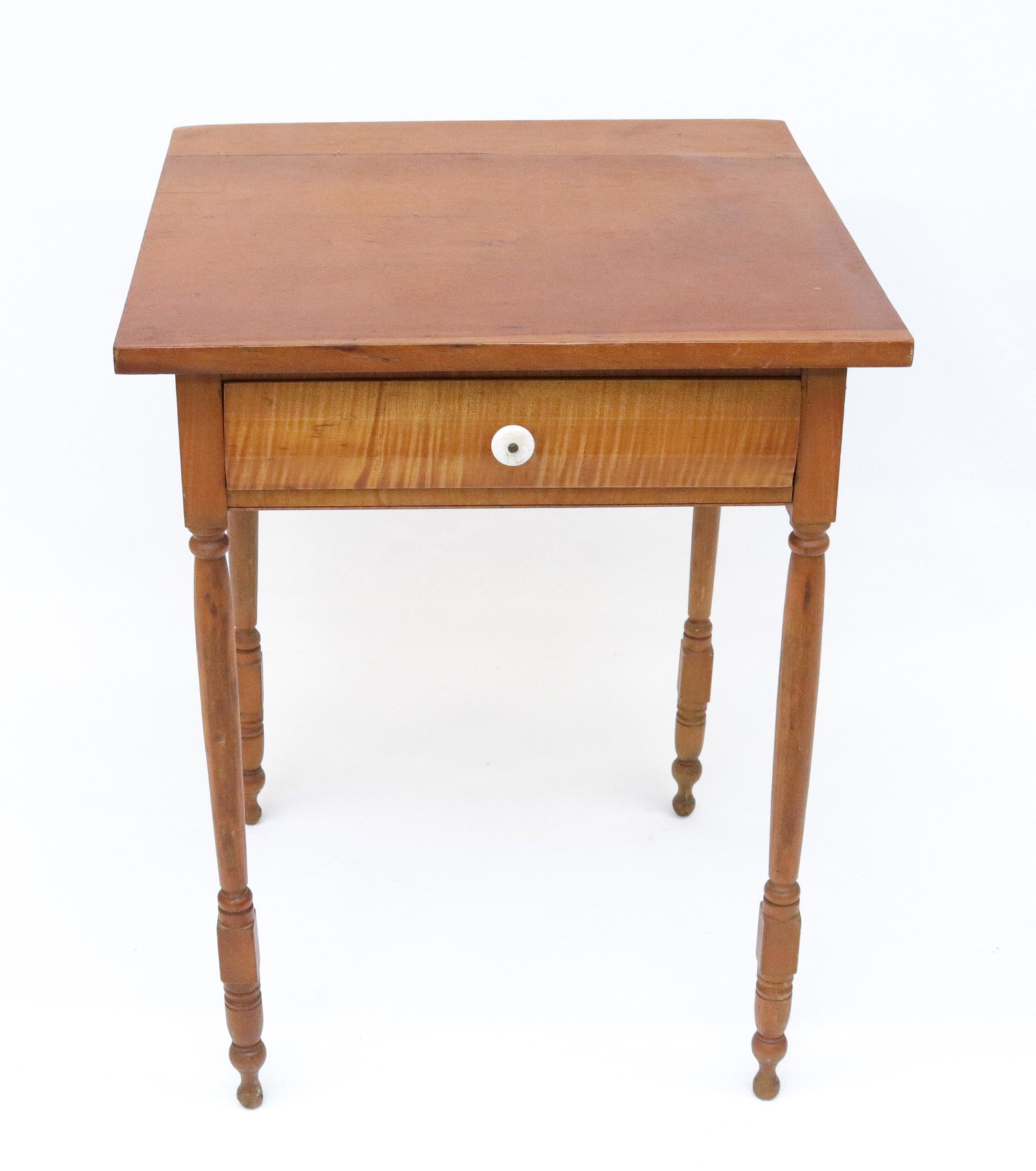 FIGURED MAPLE ONE DRAWER STAND: TURNED SPINDLE LEGS, CHERRY TOP, MAPLE FRONT AND SIDES SIZE: 29 1/2" X 22 1/2" X 22 1/2"