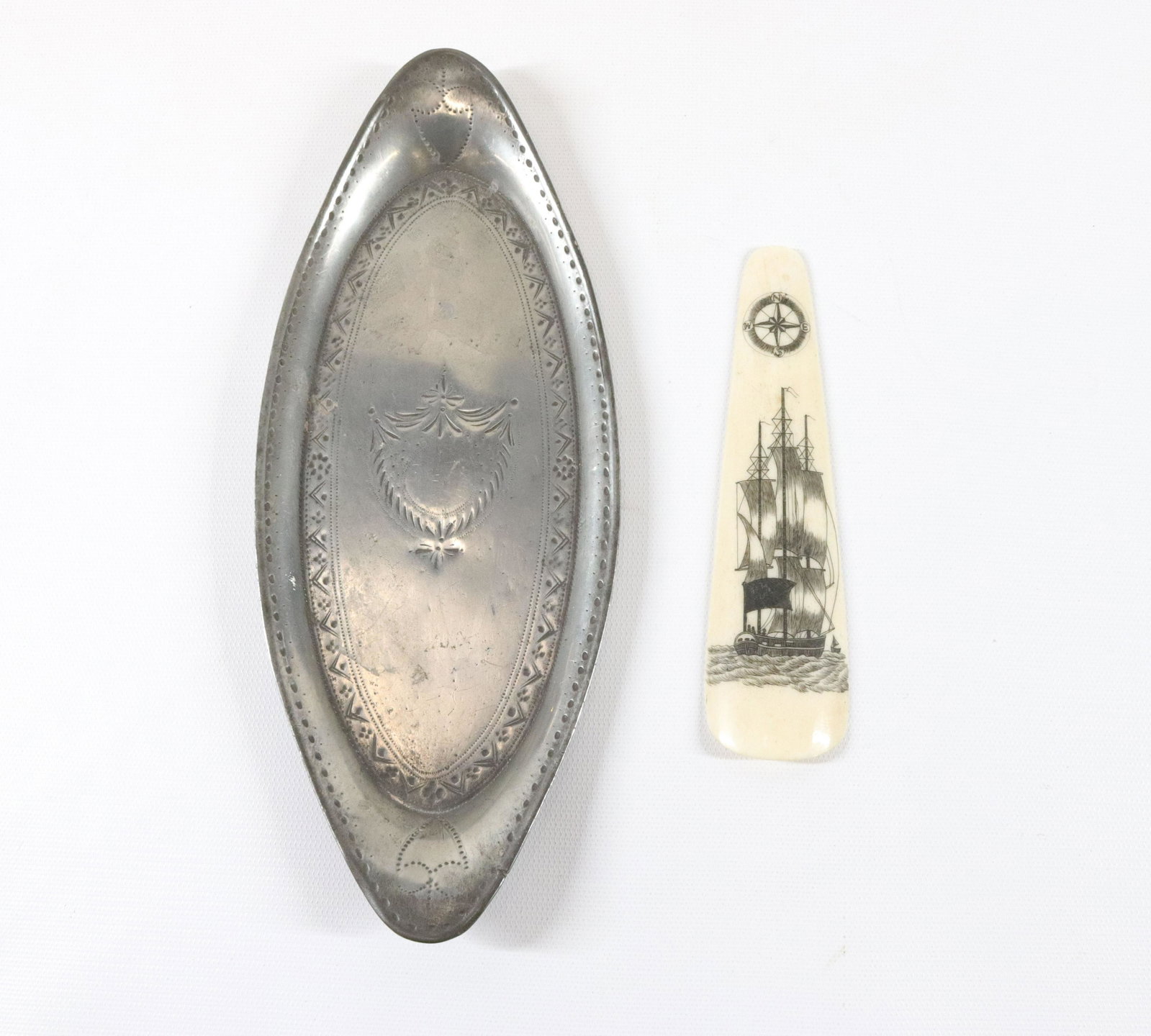 SCRIMSHAW SHOEHORN: DECORATED WITH DIRECTIONAL COMPASS, SAILING SHIP, AND FLAG WITH CROSS - DECORATED PEWTER TRAY WITH SHIELD MOTIF