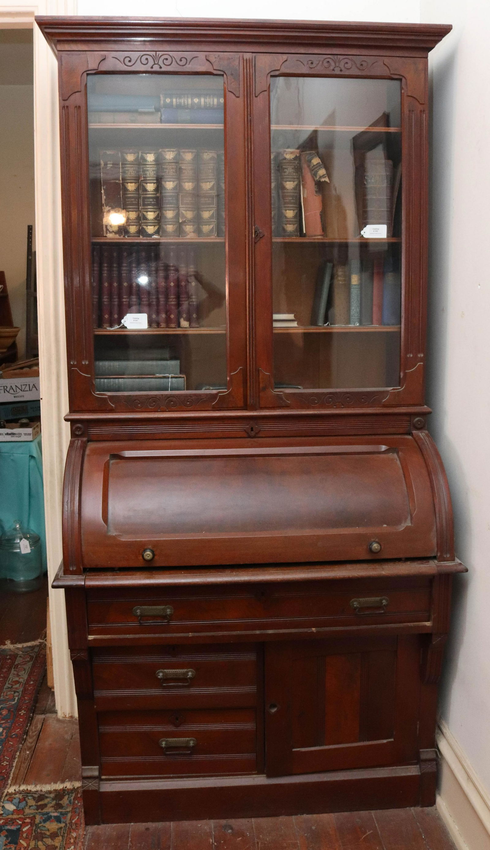 EAST LAKE VICTORIAN CYLINDER ROLL TOP DESK: TWO PIECE MAHOGANY "C" ROLL TOP SECRETARY DESK WITH BOOKCASE TOP