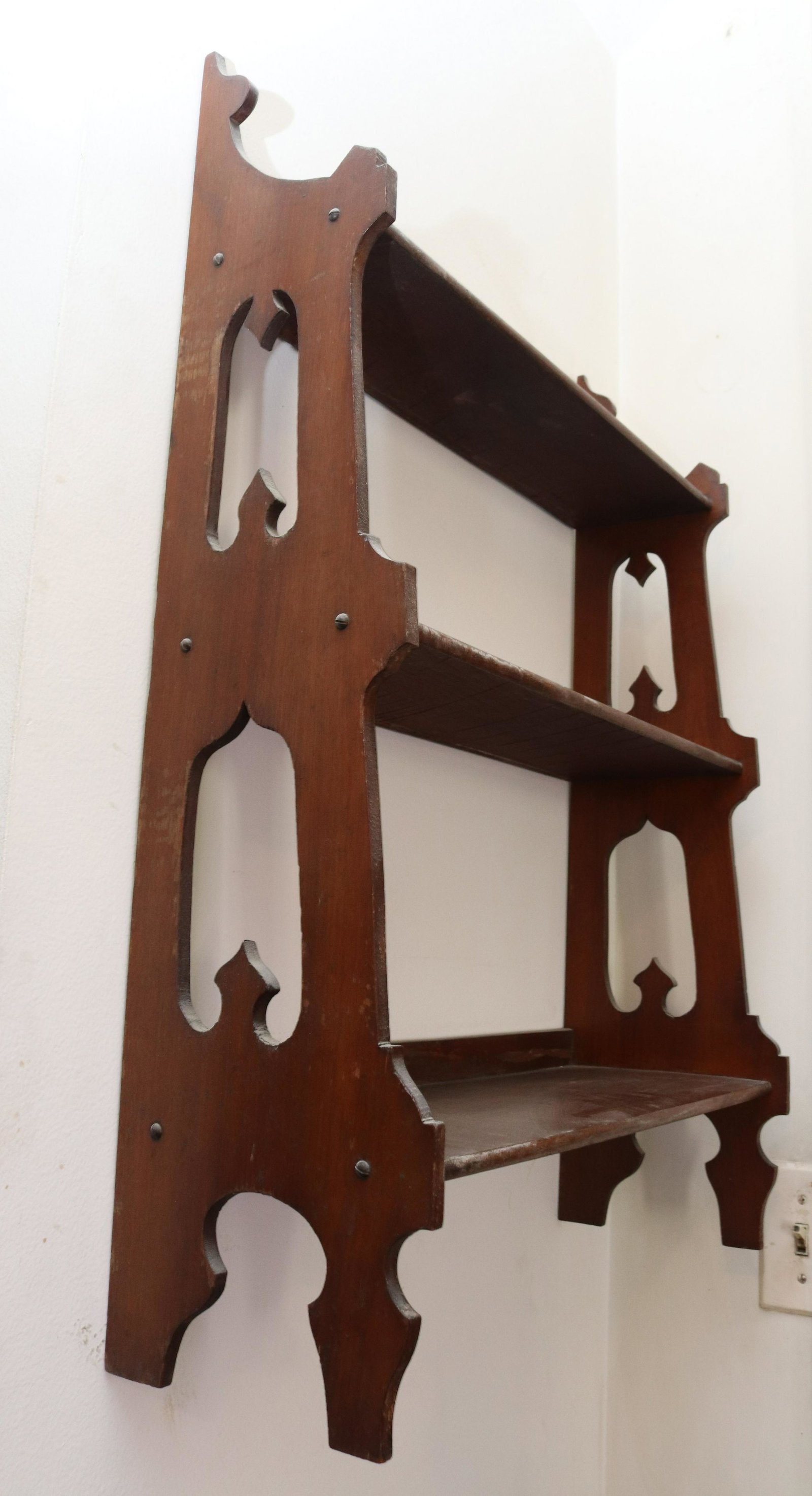 19TH CENTURY HANGING WALL SHELF: WALNUT THREE SECTION SHELF WITH CUT-OUT SIDES