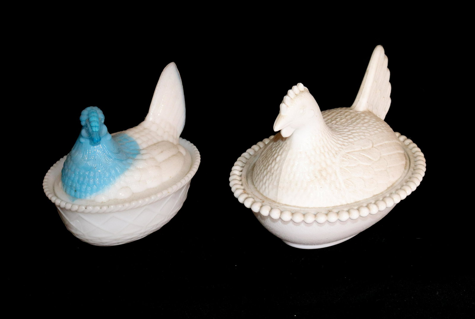 MILK GLASS HENS ON A NEST: (2) - SMALLER ONE HAS BLUE HEAD