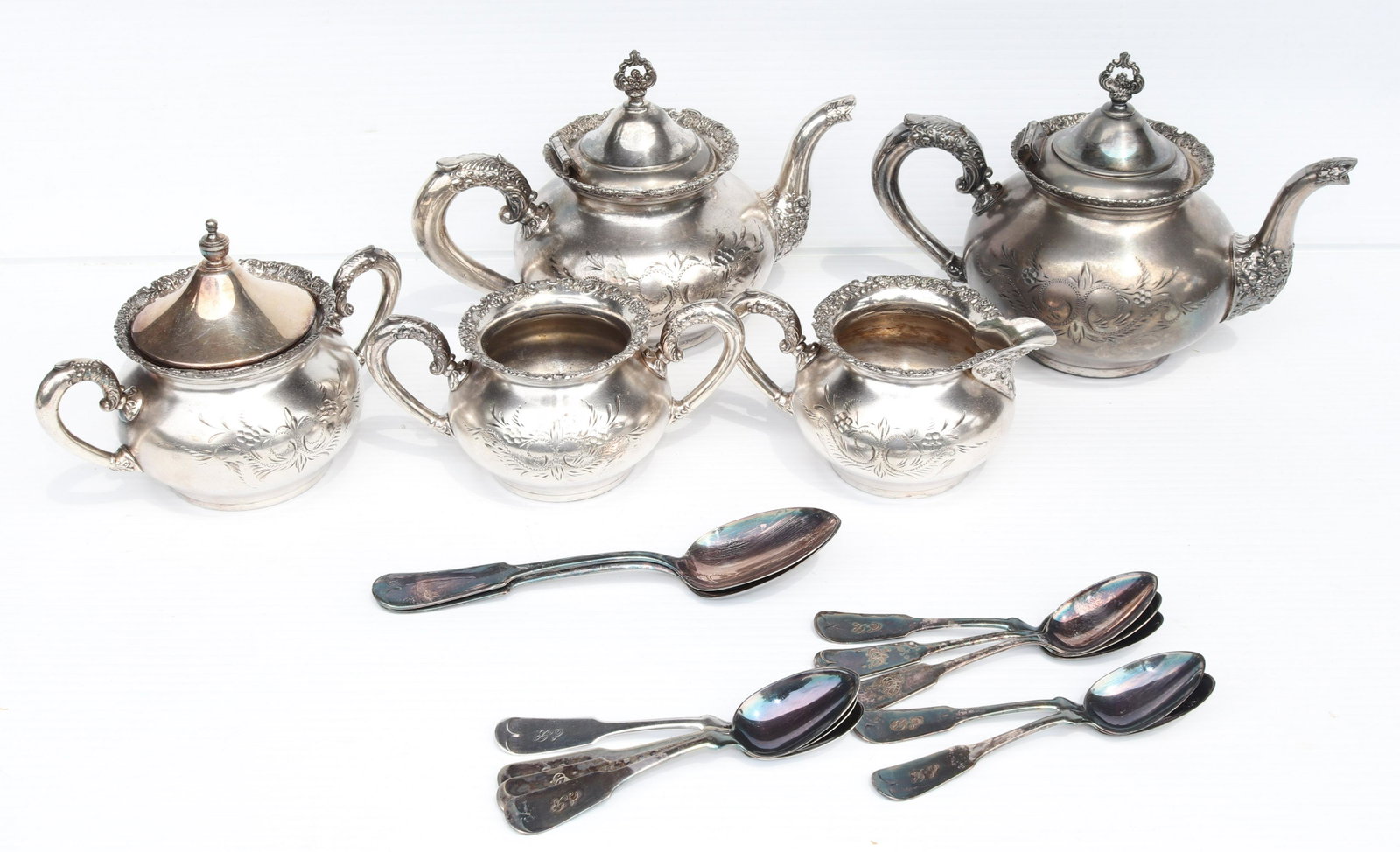 ANTIQUE SILVER PLATE LOT: QUADRUPLE PLATE LOT WITH - (2) TEAPOTS, (2) SUGARS, CREAMERS, SPOONS, AND TEASPOONS SIZE: 7" X 9" - 3" X 7" TERMS: THIS SALE WILL BE ONLINE ONLY. PICK-UP WILL BE ON-SITE AT 14 CHURCH ST. BETHLEHEM, PA