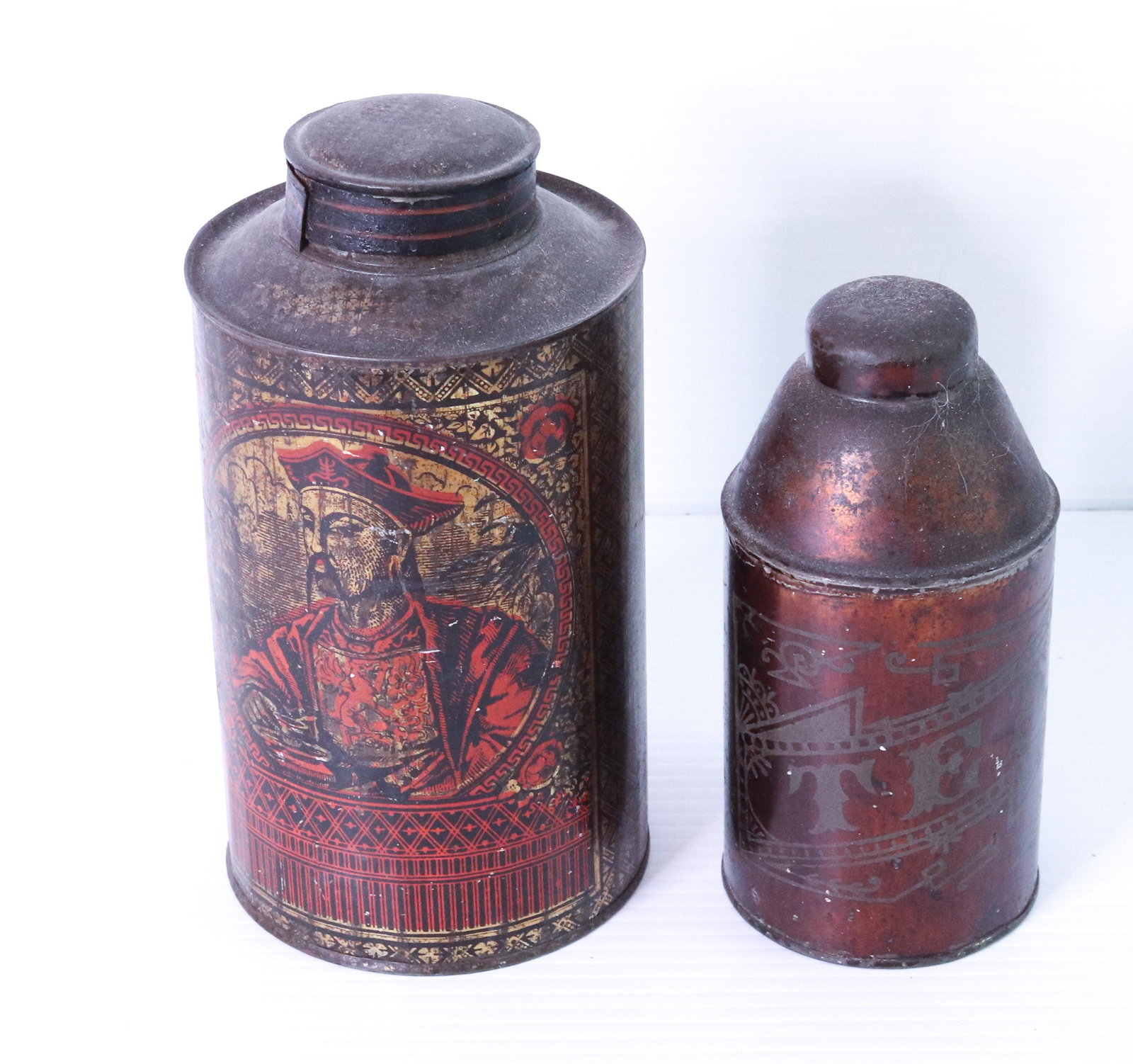 PAIR OF TEA TINS: TIN WITH LIDS. ONE MRKD. TEA, SPICE, COFFEE SIZE: 6" TO 8" H TERMS: THIS SALE WILL BE ONLINE ONLY. PICK-UP WILL BE ON-SITE AT 14 CHURCH ST. BETHLEHEM, PA 18018 - APPOINTMENTS WILL BE MADE AS PARKING I