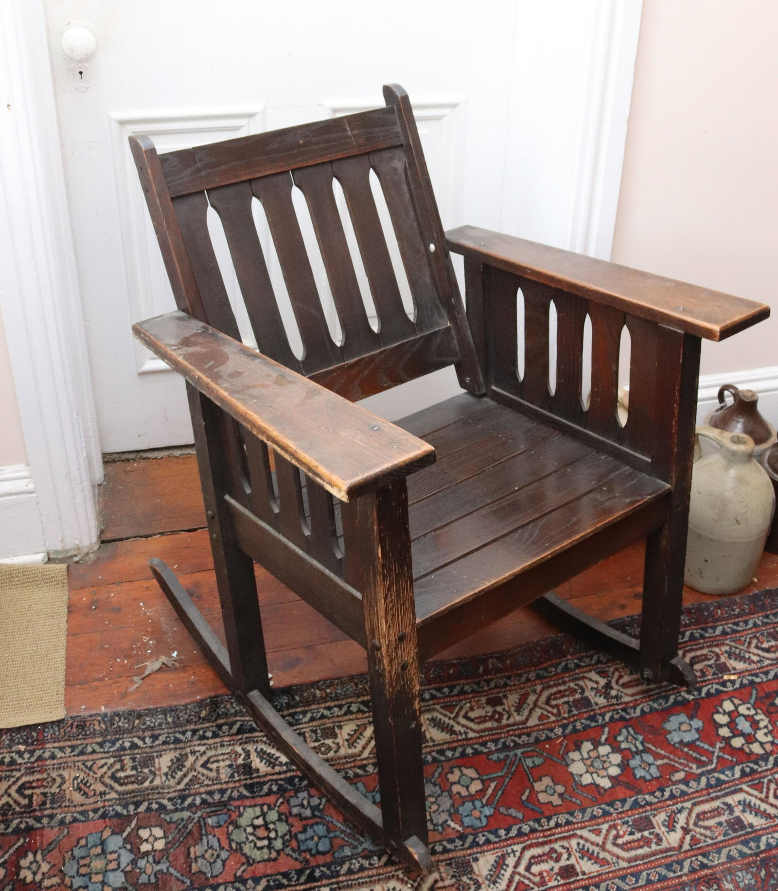 ARTS AND CRAFT STYLE ROCKING CHAIR: OAK IN DARK FINISH SIZE: 32" X 27" X 22" TERMS: THIS SALE WILL BE ONLINE ONLY. PICK-UP WILL BE ON-SITE AT 14 CHURCH ST. BETHLEHEM, PA 18018 - APPOINTMENTS WILL BE MADE AS PARKING IS VERY LIMITED - PIC