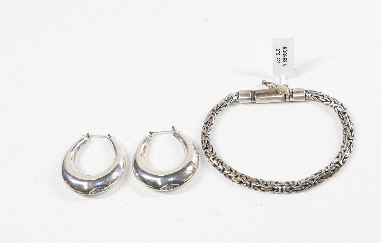 CONTEMPORARY STERLING SILVER JEWELRY LOT: BRACELET, HOOP EARRINGS- 1.14 OZT SIZE: 8"