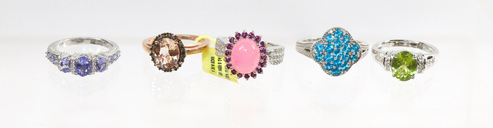 CONTEMPORARY STERLING SILVER RING LOT: 5 RINGS- TANZANITE, PERIDOT, TOPAZ, PINK AND CZs, PINK CABOCHON SIZE: SIZE-8(4),9